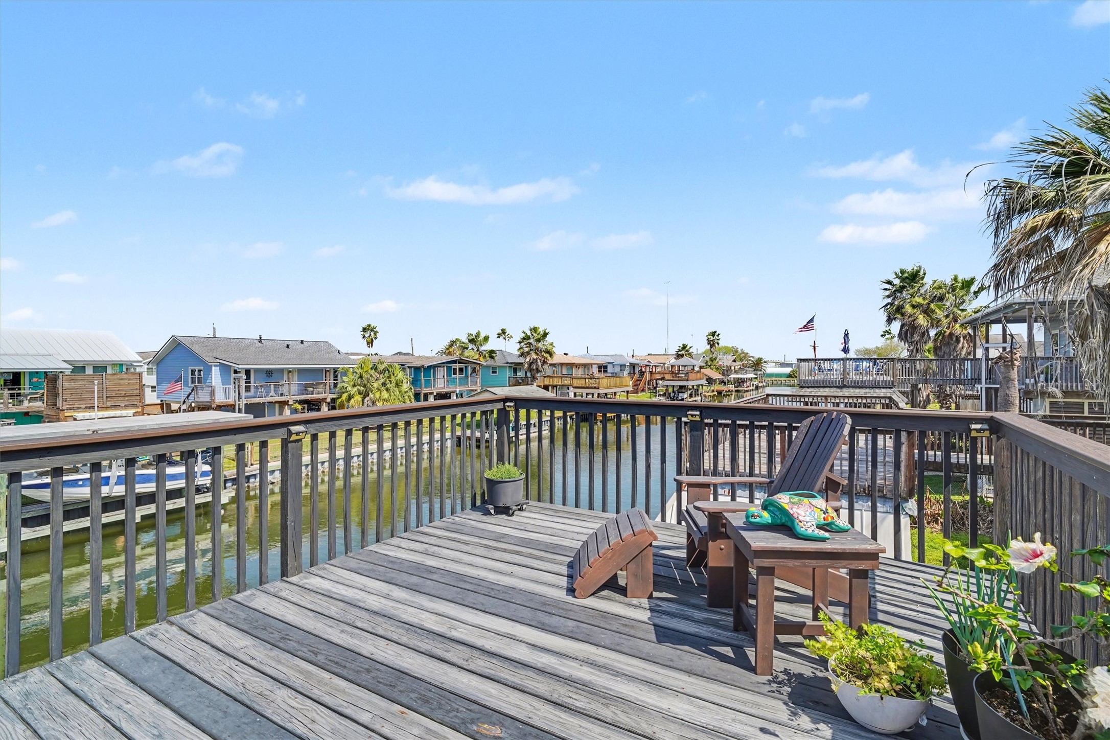 Spacious upper party deck offering ample room for outdoor dining and comfortable lounging. Designed for both entertaining and relaxation, this inviting space captures the essence of coastal living with plenty of room to gather, dine, and unwind in style