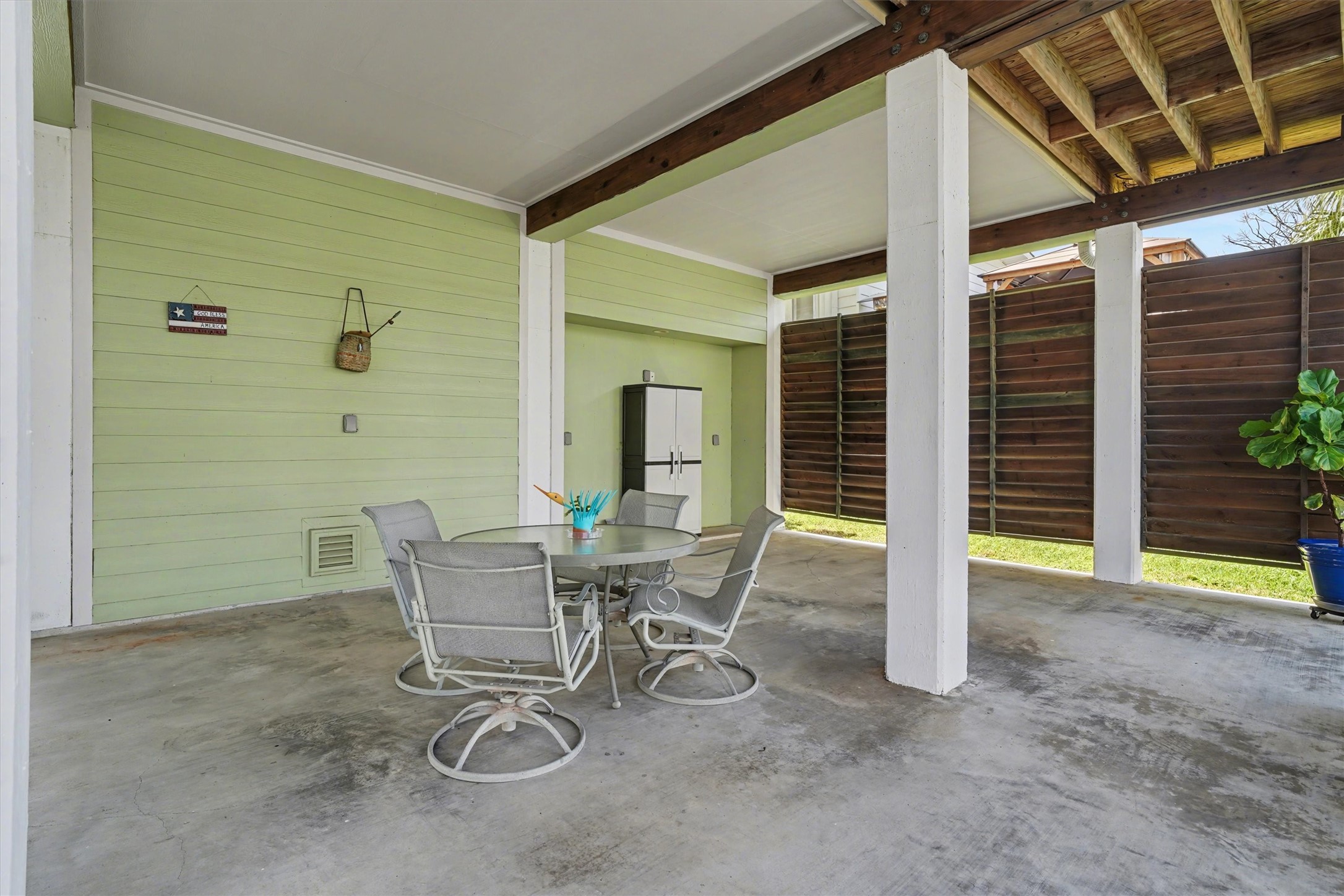 Downstairs open area designed as the heart of waterfront living, offering generous space for outdoor dining and a large sectional sofa. Perfect for entertaining, relaxing, and enjoying the coastal breeze, this inviting space captures the essence of life by the water