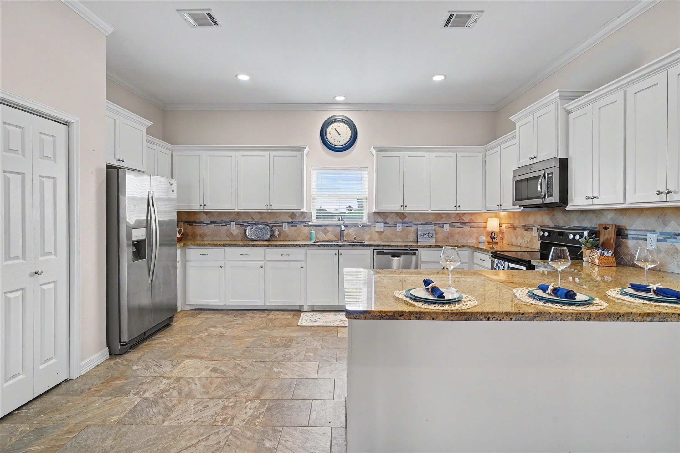 With ample seating and a seamless flow into the dining and living areas, this kitchen is as functional as it is stylish