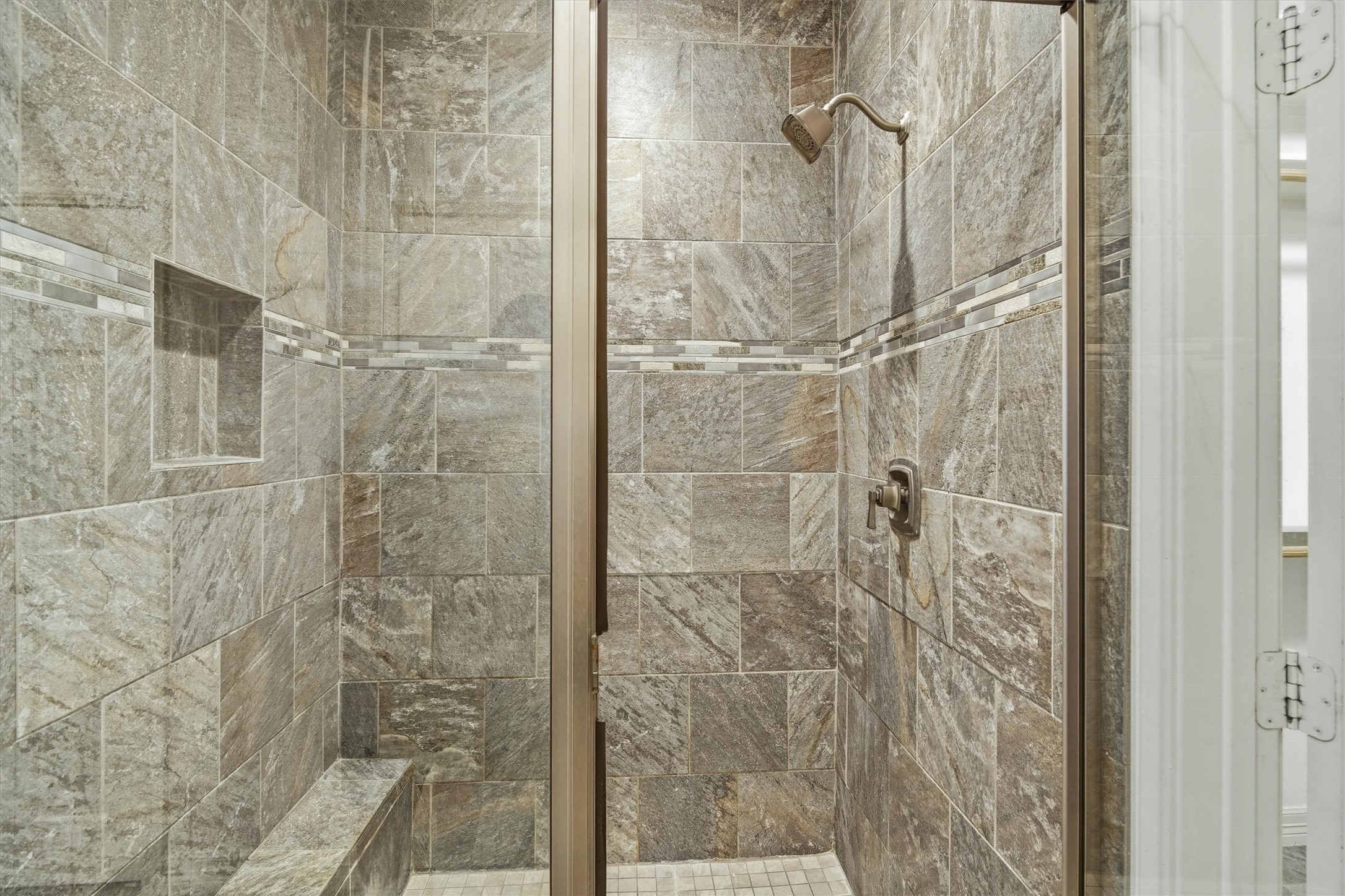 The custom tiled, over sized shower with detail work is a perfect way to wind down after a day fishing on your boat