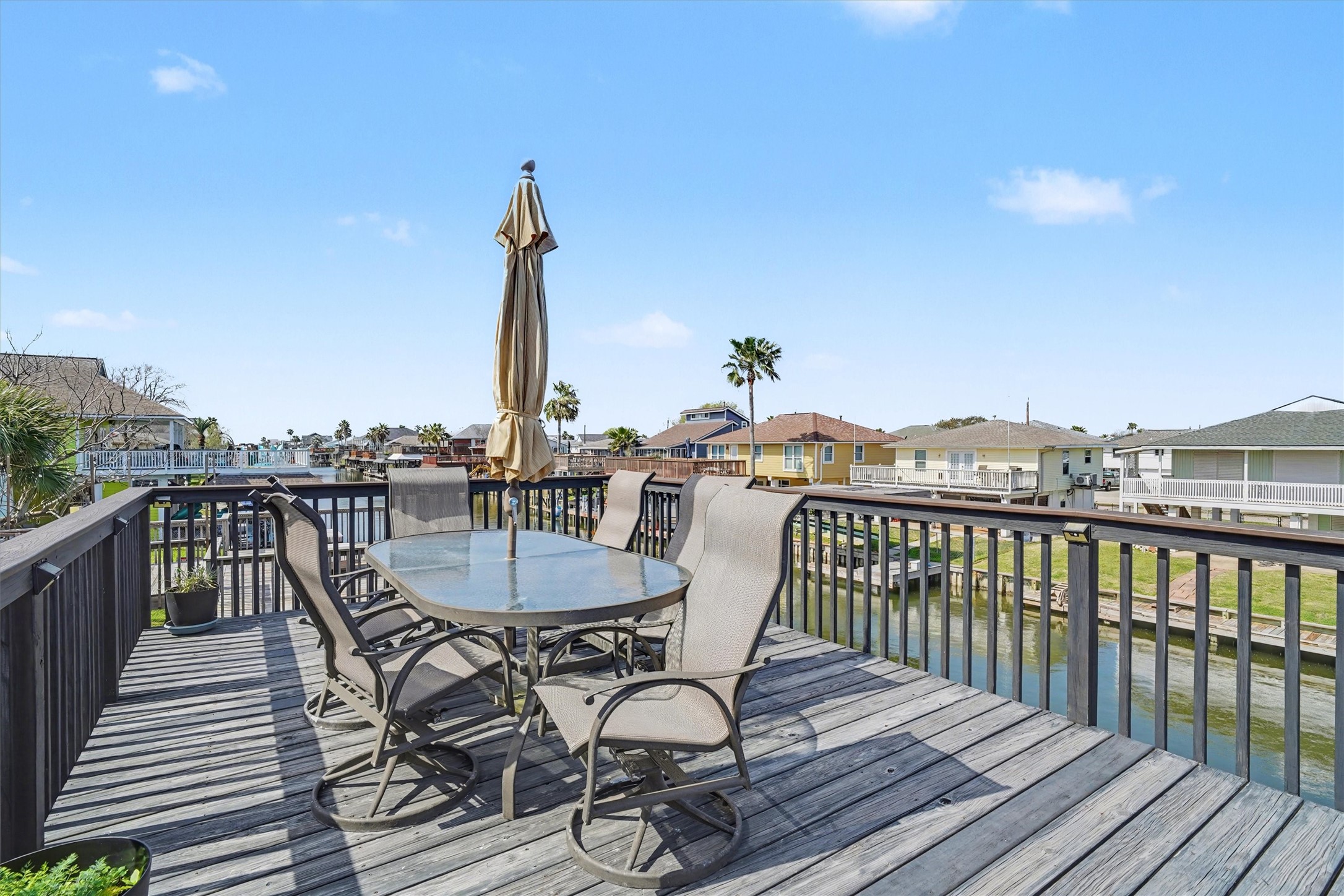 Upper party deck designed for pure relaxation and coastal enjoyment. Picture unwinding after a long day, cold beverage in hand, as gentle breezes and waterfront views create the perfect end to any day. A true outdoor sanctuary for entertaining or simply soaking in the serenity