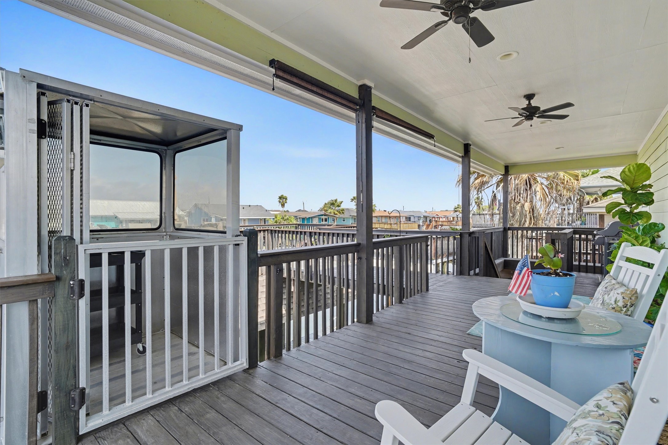 Charming covered porch offering a welcoming entry and relaxing outdoor space, complemented by a convenient enclosed cargo liftblending coastal style with everyday functionality for effortless living. The cargo lift is an expensive addition Charming covered porch offering a welcoming entry and relaxing outdoor space, complemented by a convenient enclosed cargo liftblending coastal style with everyday functionality for effortless living. The cargo lift is an expensive addition