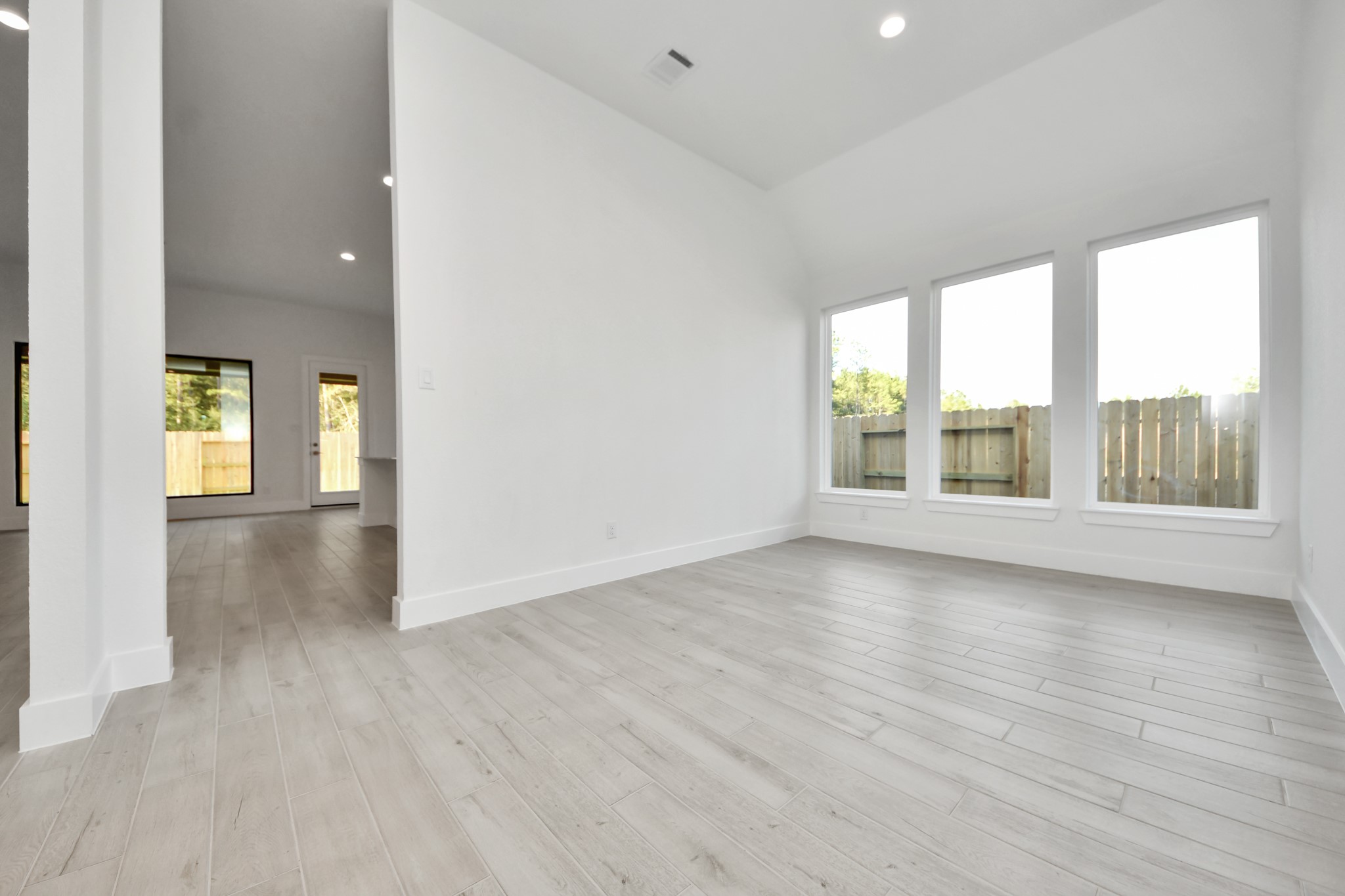 Make memories gathered around the table with your family and friends! This spacious dining room features elegant flooring, custom paint, and adjacent to family room and kitchen for open concept feel.