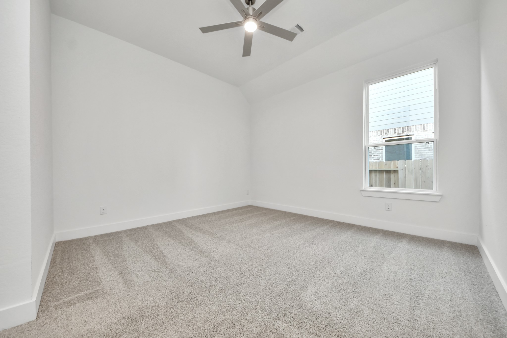 Generously sized secondary bedrooms featuring spacious closets, soft and inviting carpeting underfoot, large windows allowing plenty of natural light, and the added touch of privacy blinds for your personal retreat.