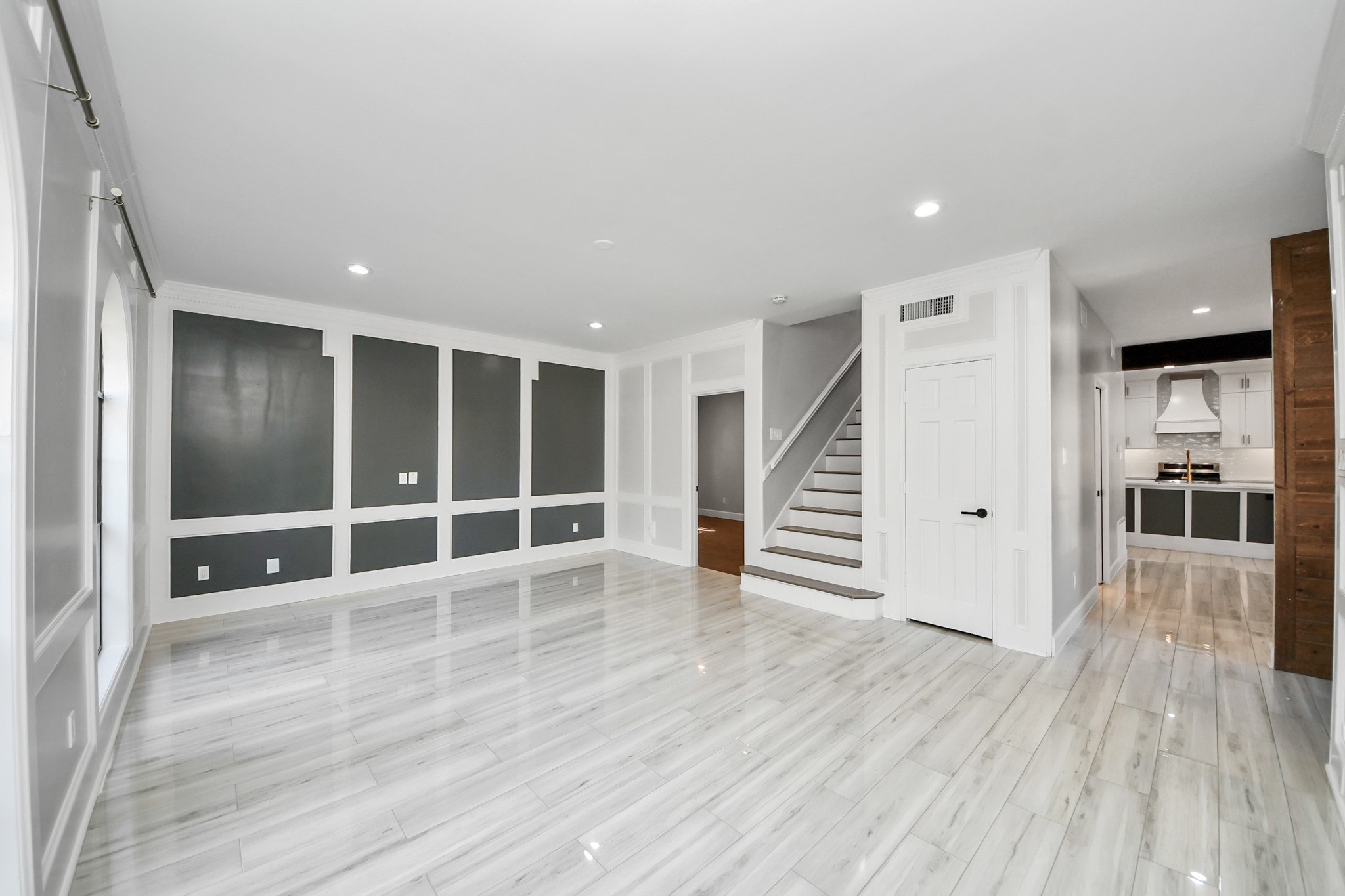 View from formal living room to upstairs and into kitchen