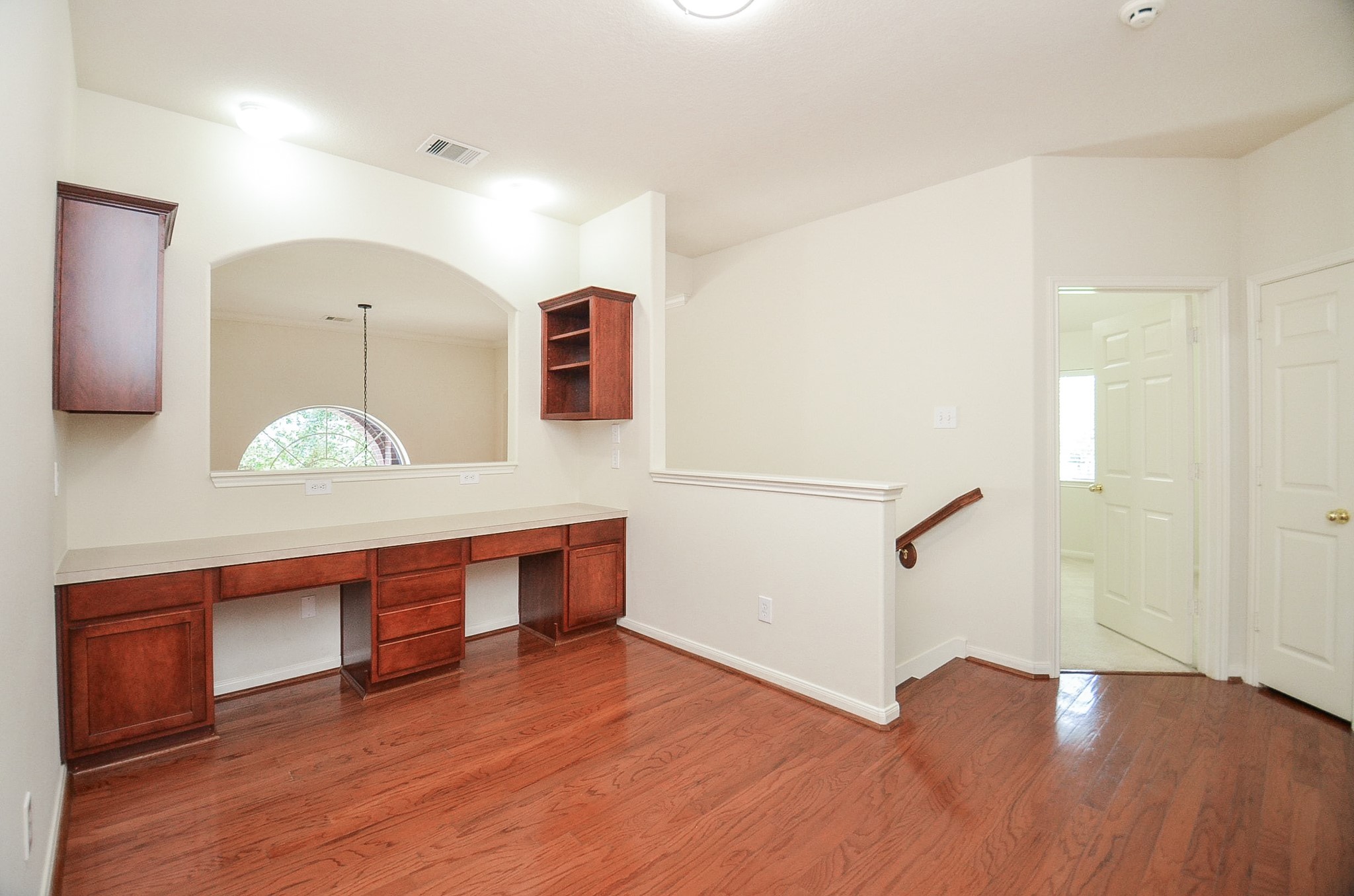 Versatile and inviting, this room features neutral tones, and abundant natural light, ideal for a home office, guest room, or creative space.