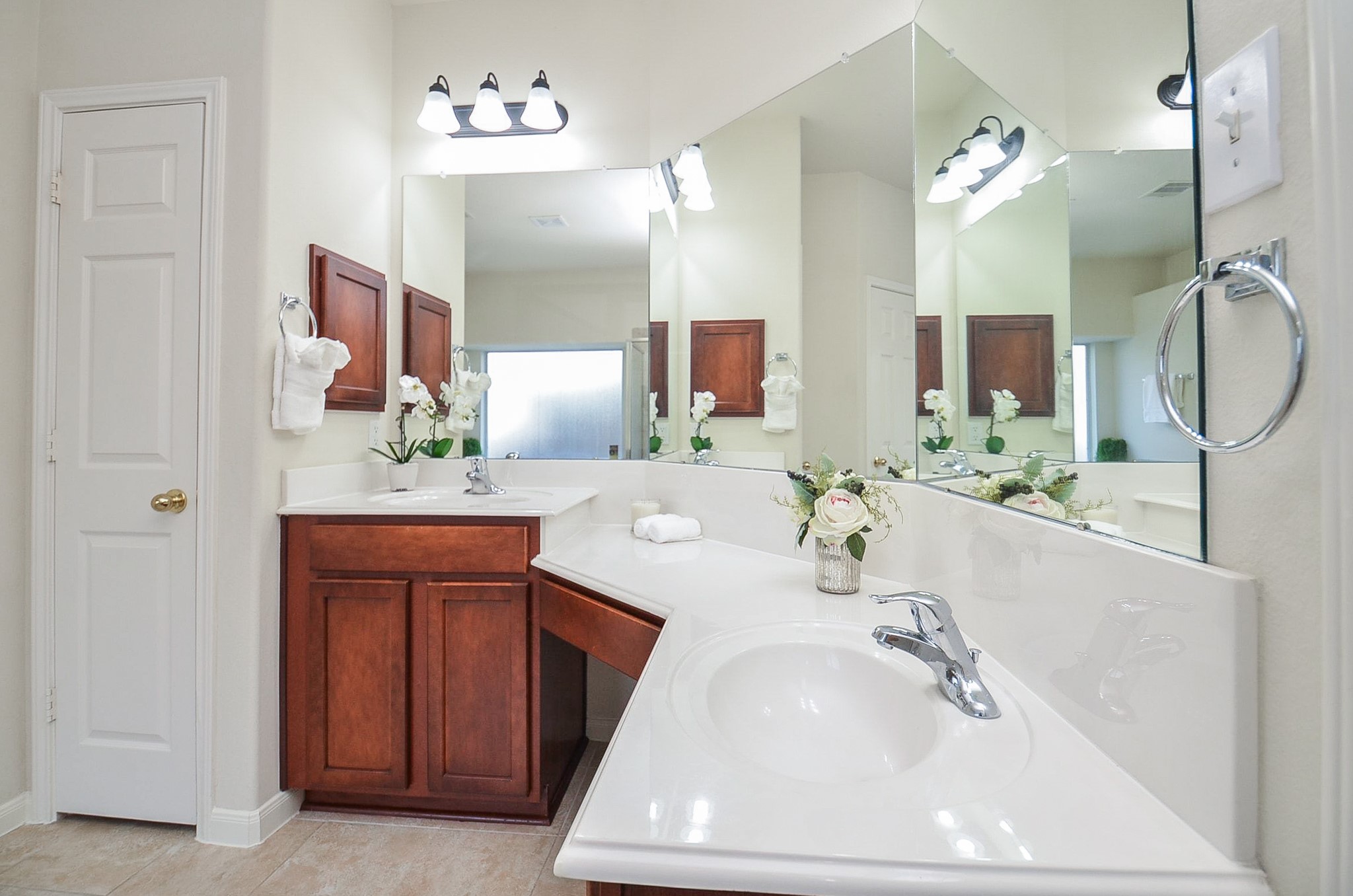 Experience the serene ambiance of this spacious primary bathroom, bathed in natural light and designed for ultimate relaxation.