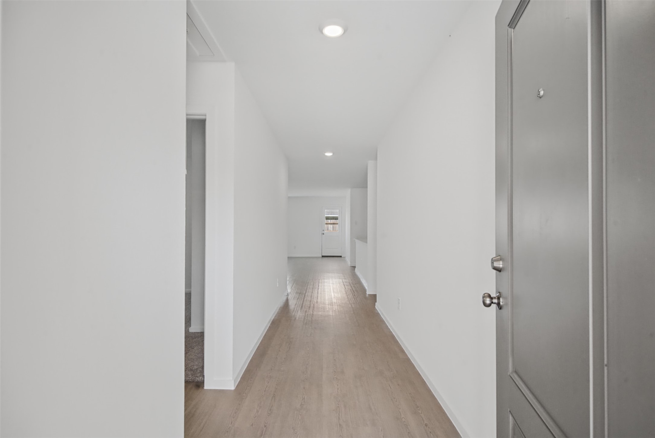Step inside and immediately feel the clean, welcoming flow of the home, with a bright entry that leads naturally into the main living spaces.
