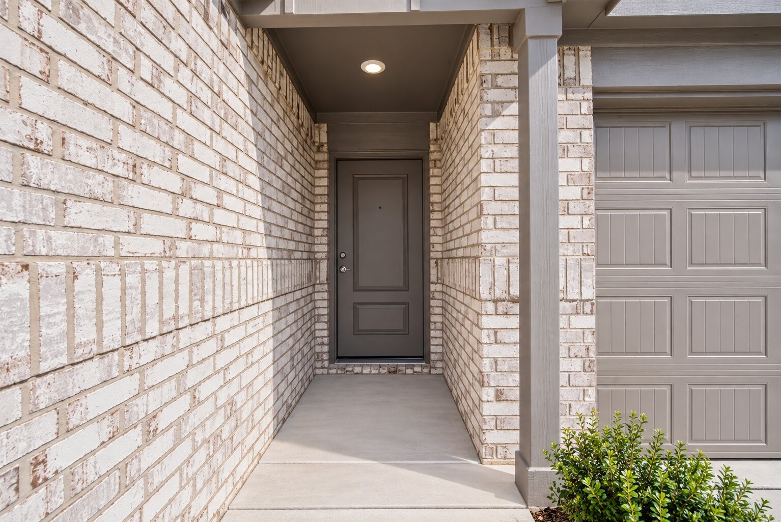 A covered front entry offers a warm welcome while adding a touch of privacy and shelter as you step into your new home.