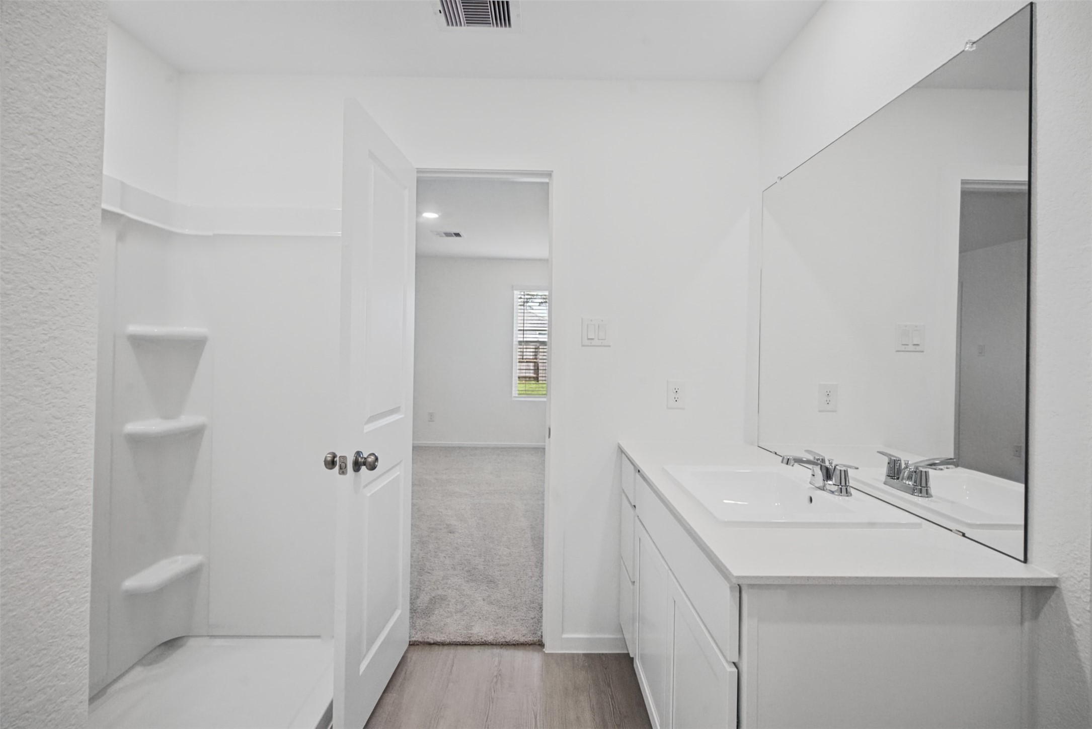 A clean, bright ensuite designed with everyday functionality in mind, keeping your private bedroom and bath spaces conveniently connected.
