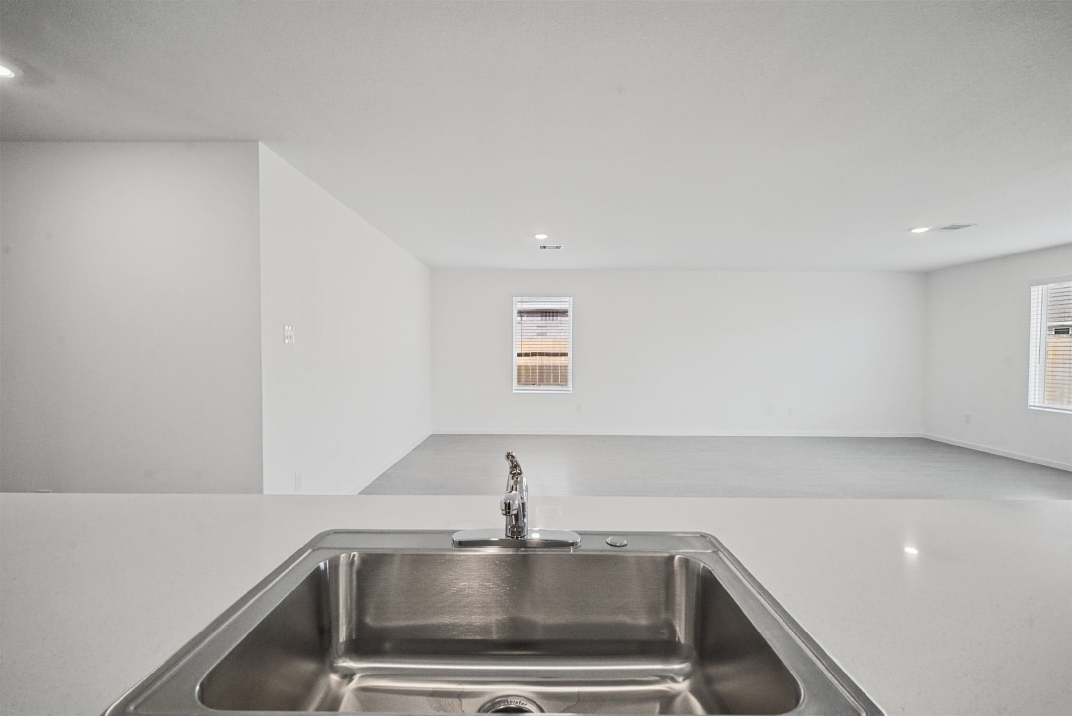 Imagine bar stools lined up here for breakfast or guests keeping you company while you cook, the expansive peninsula adds flexibility to the heart of the home.