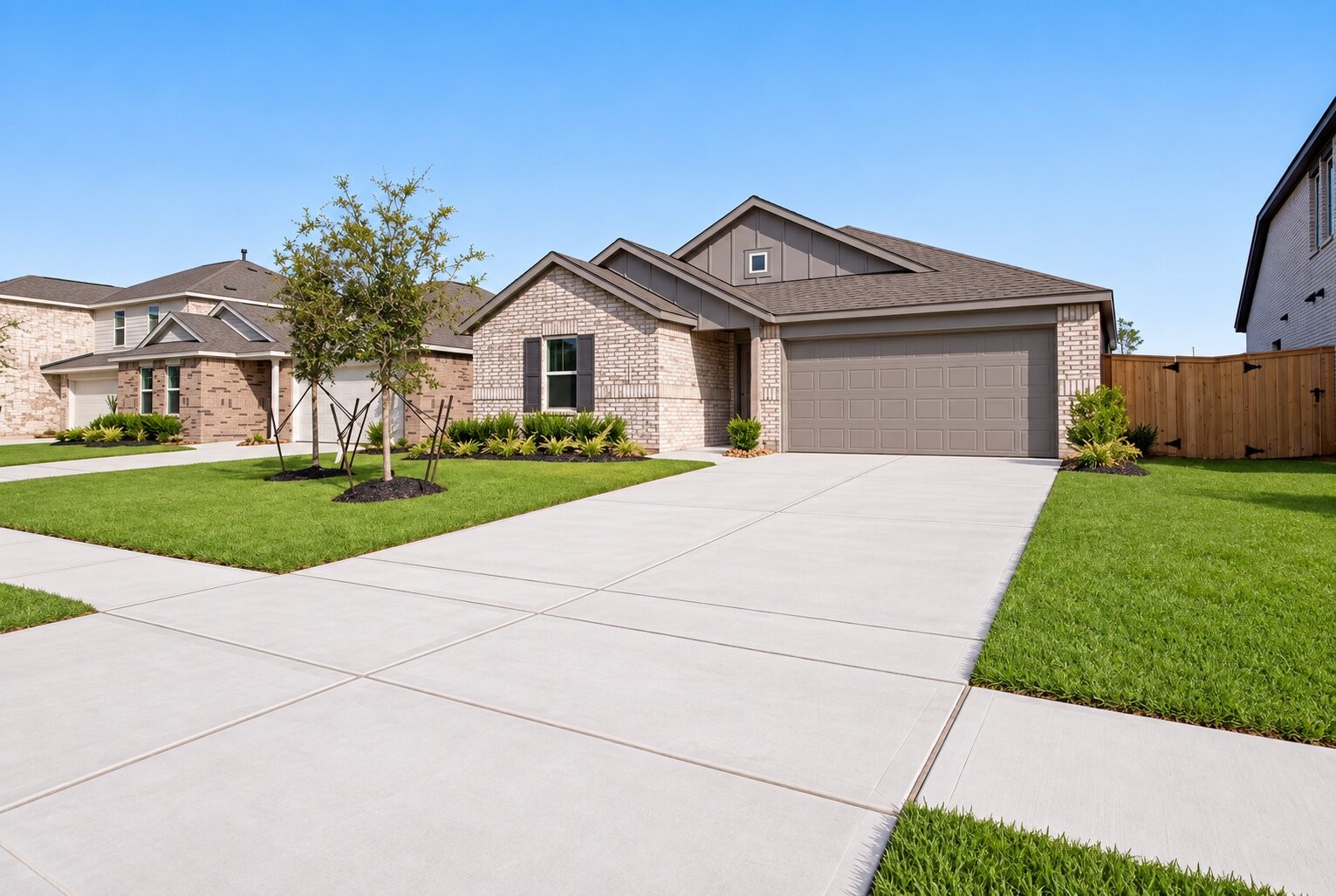 Arrive home to effortless curb appeal, with a spacious driveway, attached garage, and welcoming exterior that makes everyday living feel easy.