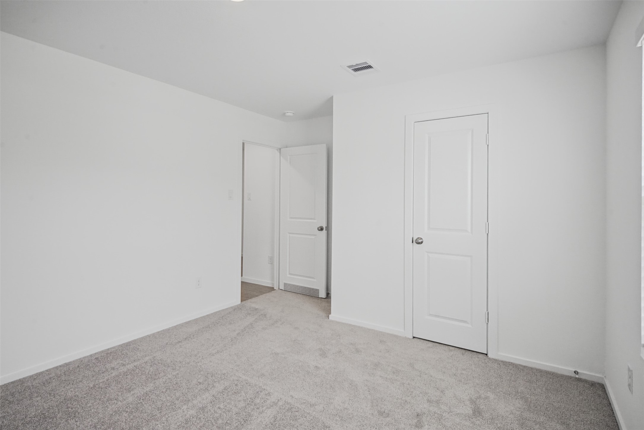 Comfortable proportions and a neutral palette make this bedroom a blank canvas ready for your furniture, dcor, and personal style.