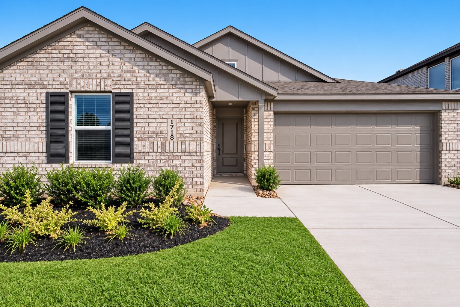 A closer look at the homes charming brick exterior and beautifully maintained landscaping sets the tone for the clean, contemporary spaces waiting inside.
