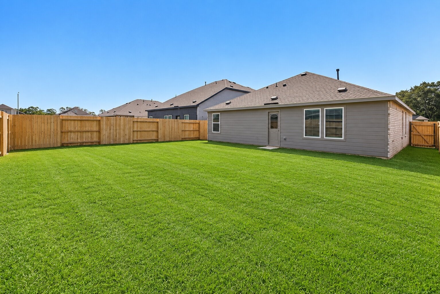 Indoor-outdoor living gets an upgrade with a spacious backyard just steps from the home. Ready for everything from quiet mornings to relaxed evenings outside.