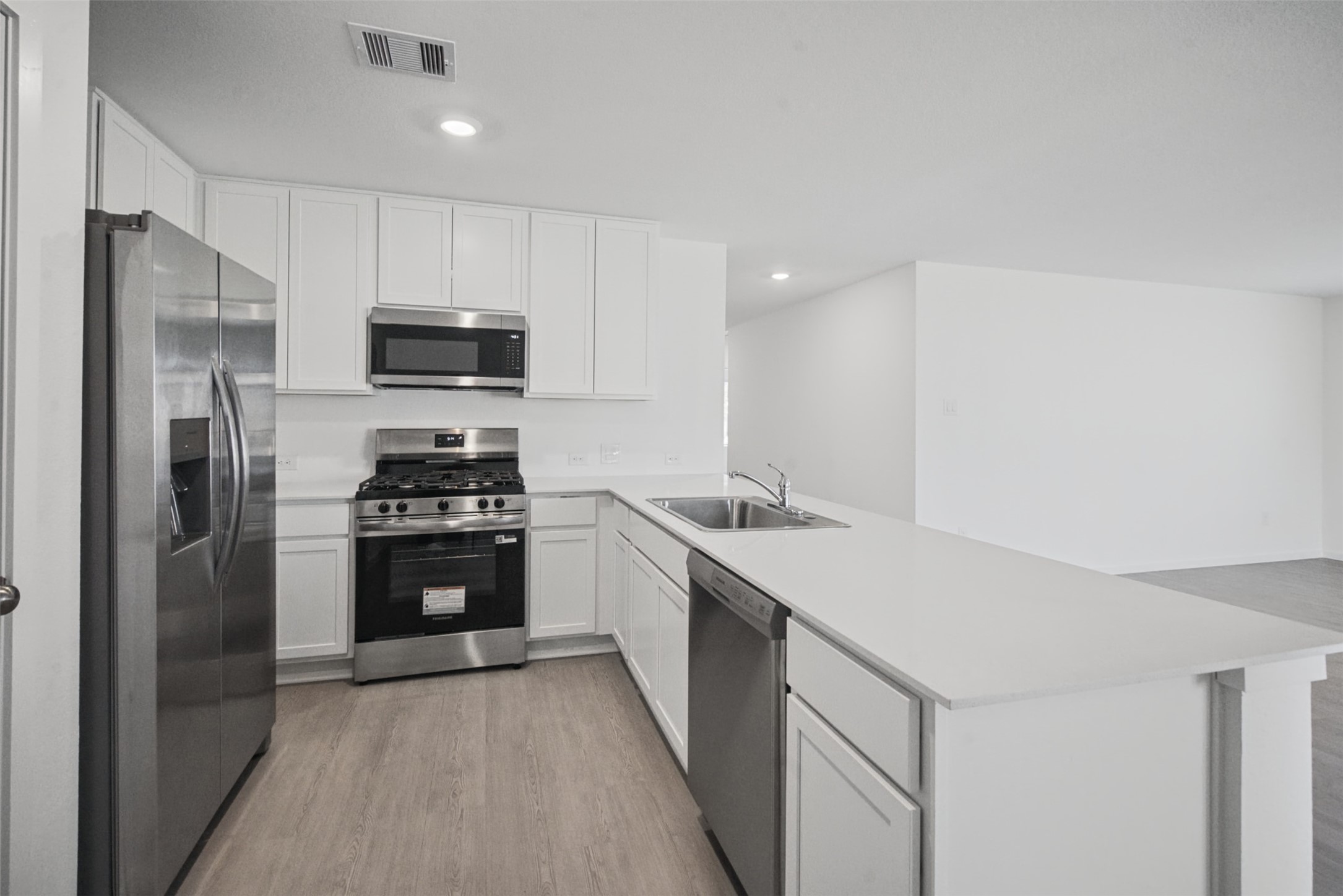 Plenty of room to prep, cook, and stay organized. Generous counter space and cabinetry make this kitchen as practical as it is inviting.