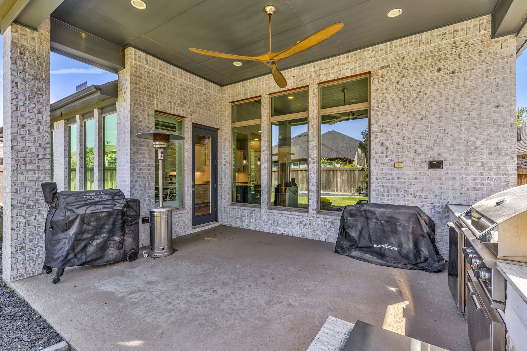 Large covered patio with custom fan