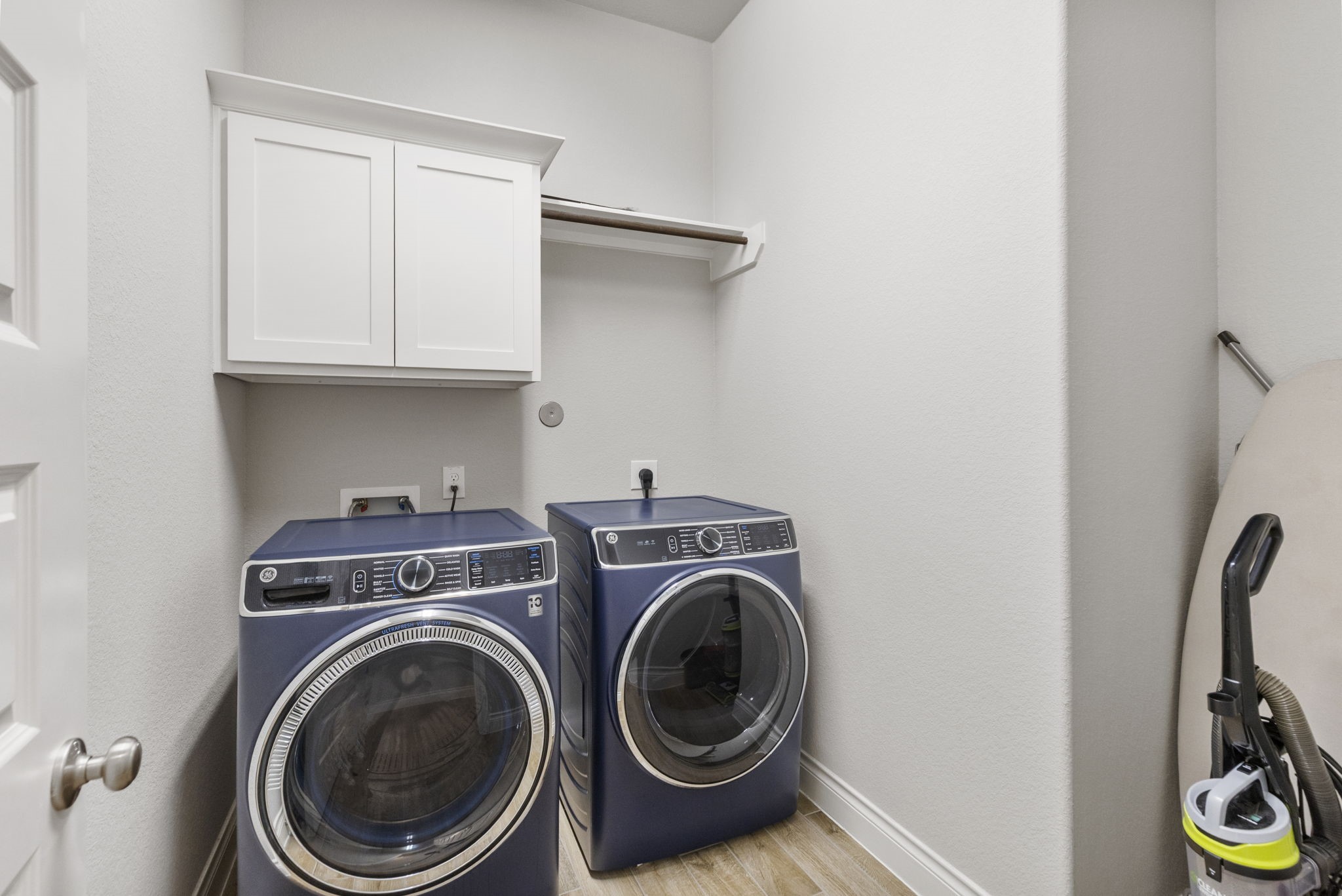 Oversized laundry room with space for an addition refrigerator/freezer
