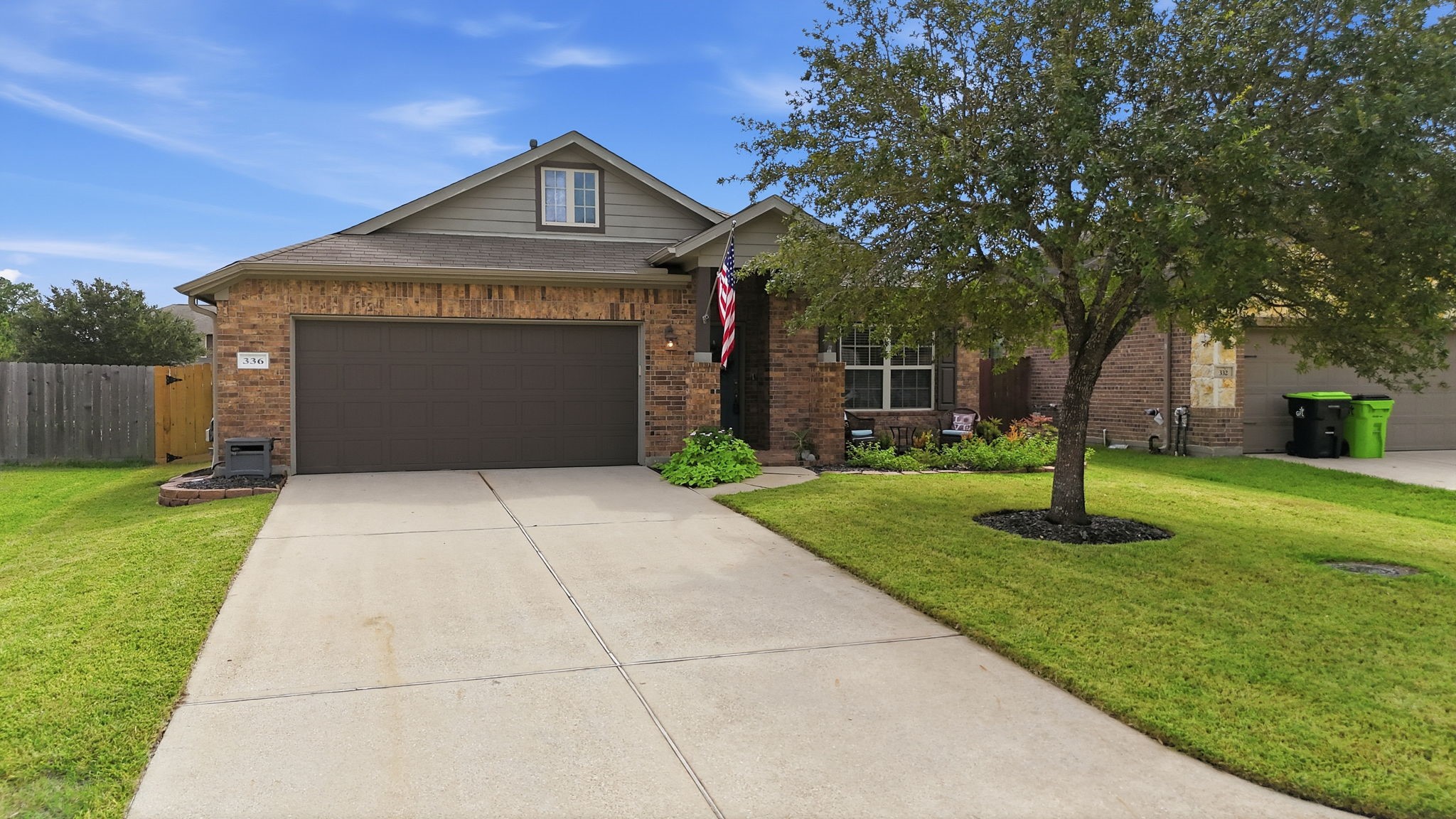 Charming brick home with a two-car garage, lush front yard, and a welcoming porch, set on a quiet street. Charming brick home with a two-car garage, lush front yard, and a welcoming porch, set on a quiet street.