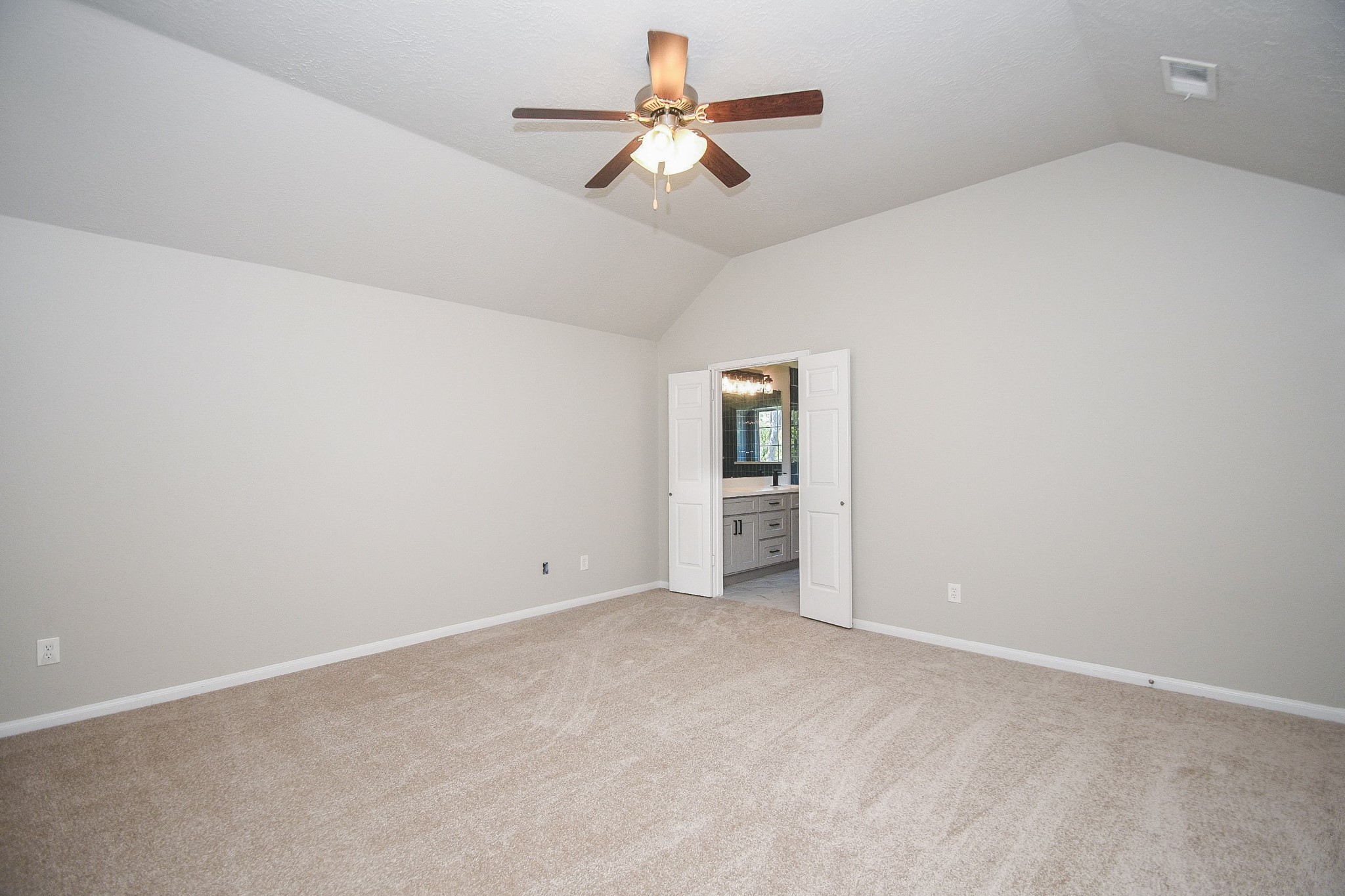 This primary room is quite large! New carpet!