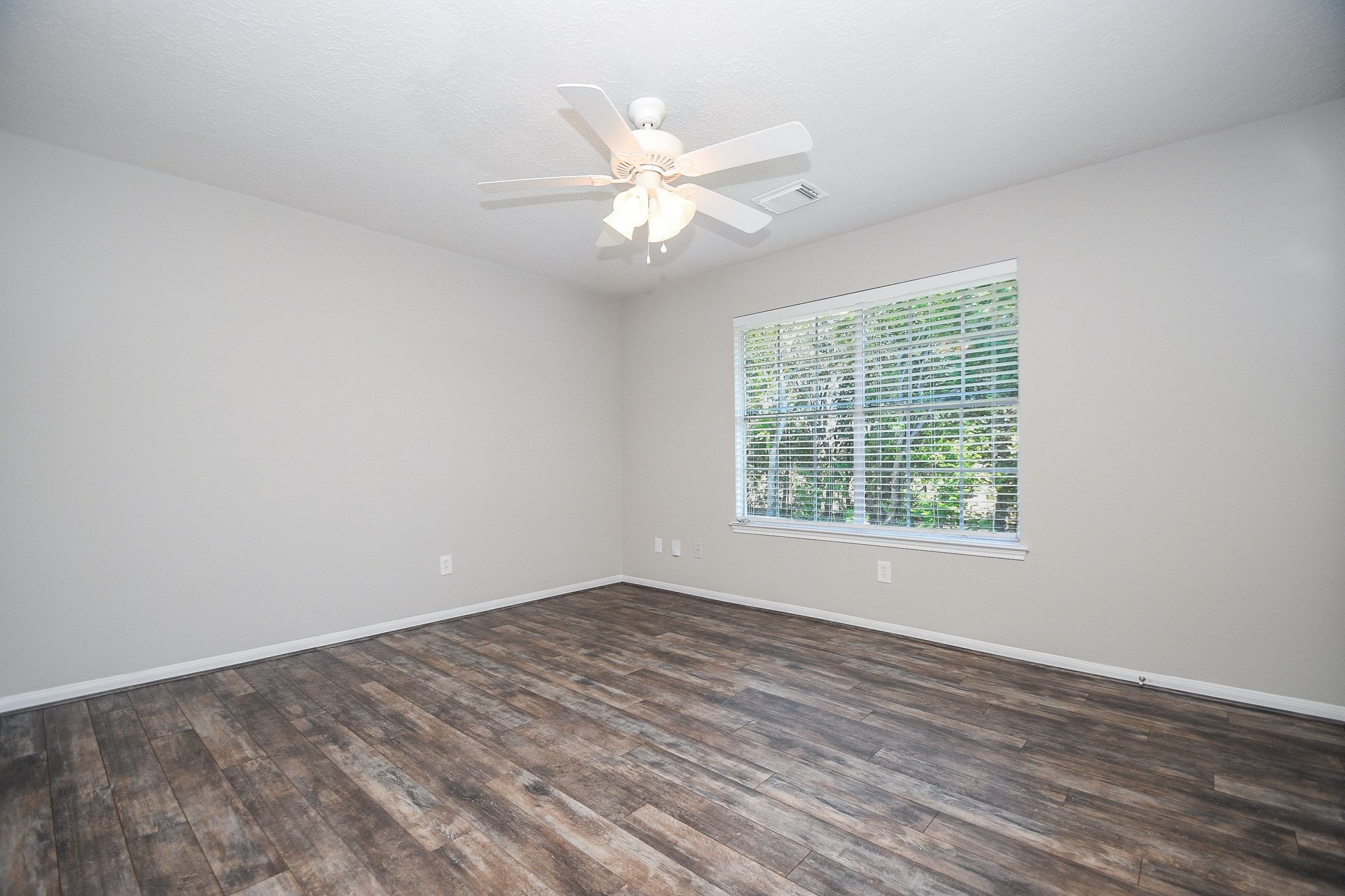 This room has solid surfaced flooring and can be used as a study or another bedroom.