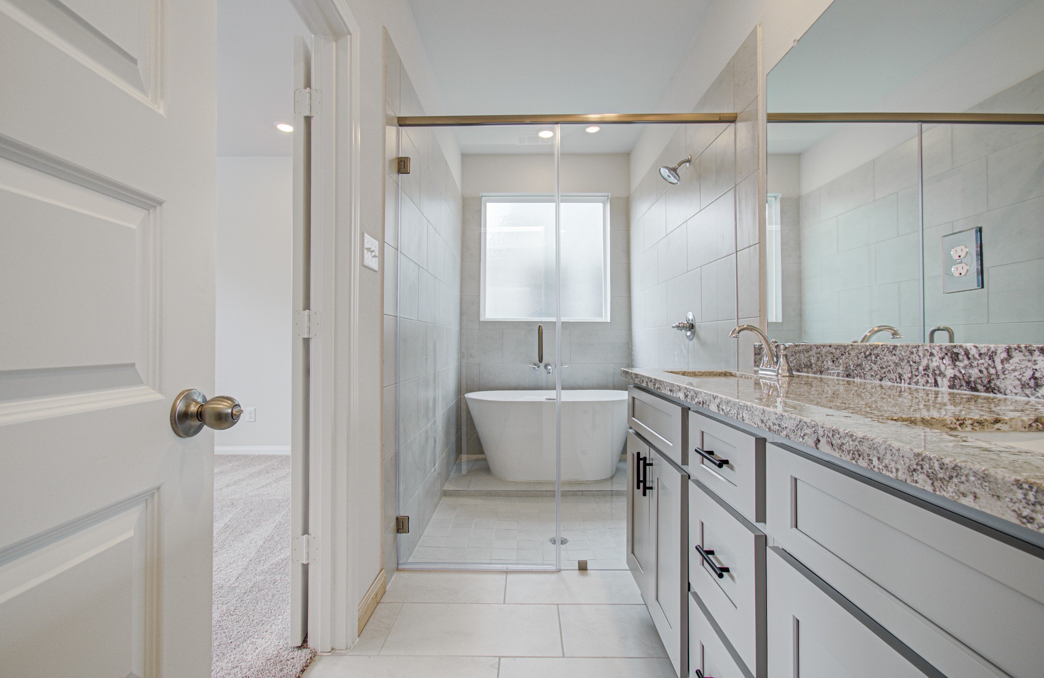 Primary Bathroom is spa-like! Please Note this is a different home/floorplan in the community.