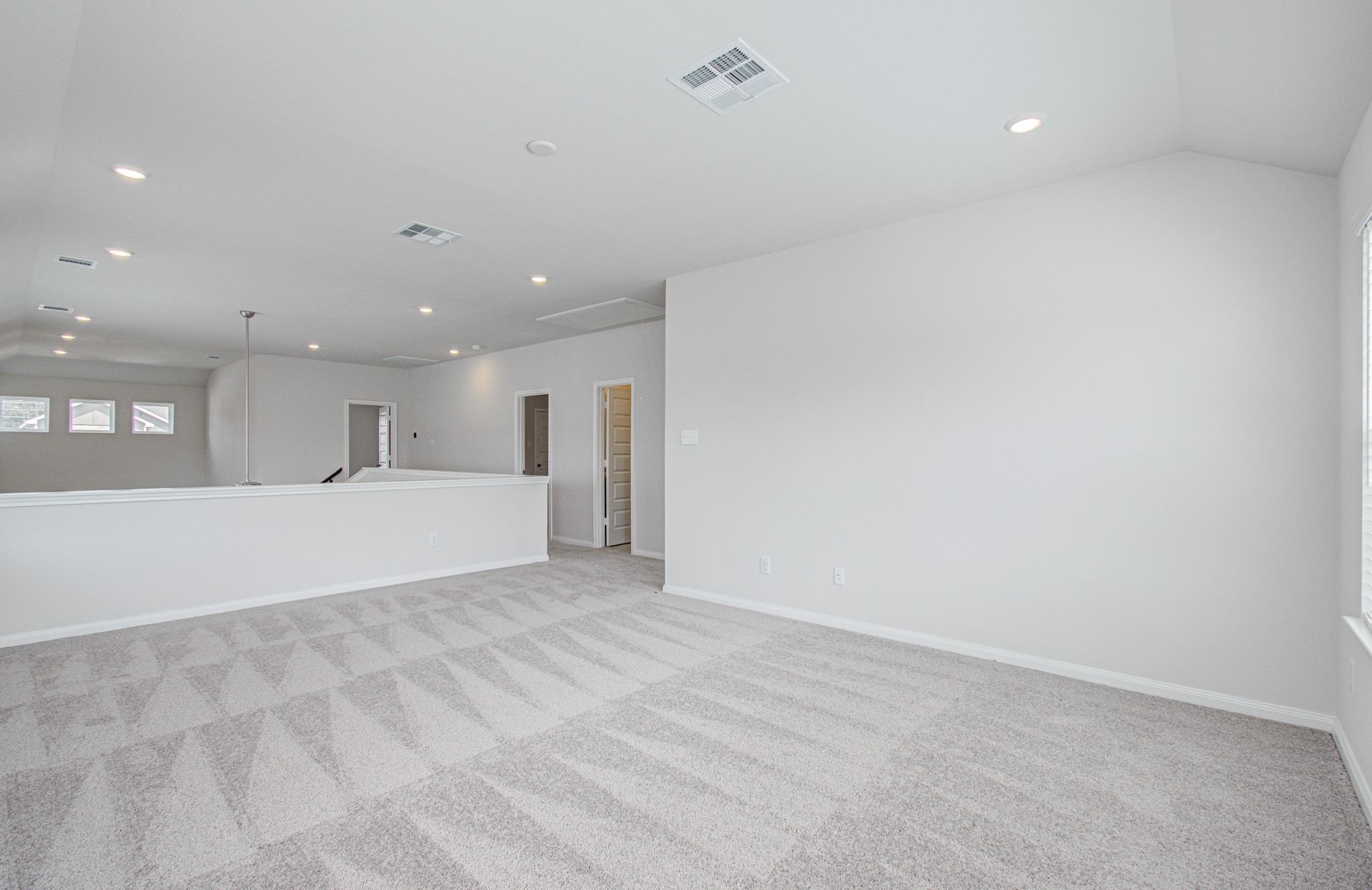 Upstairs loft game-room area. Please Note this is a different home/floorplan in the community.