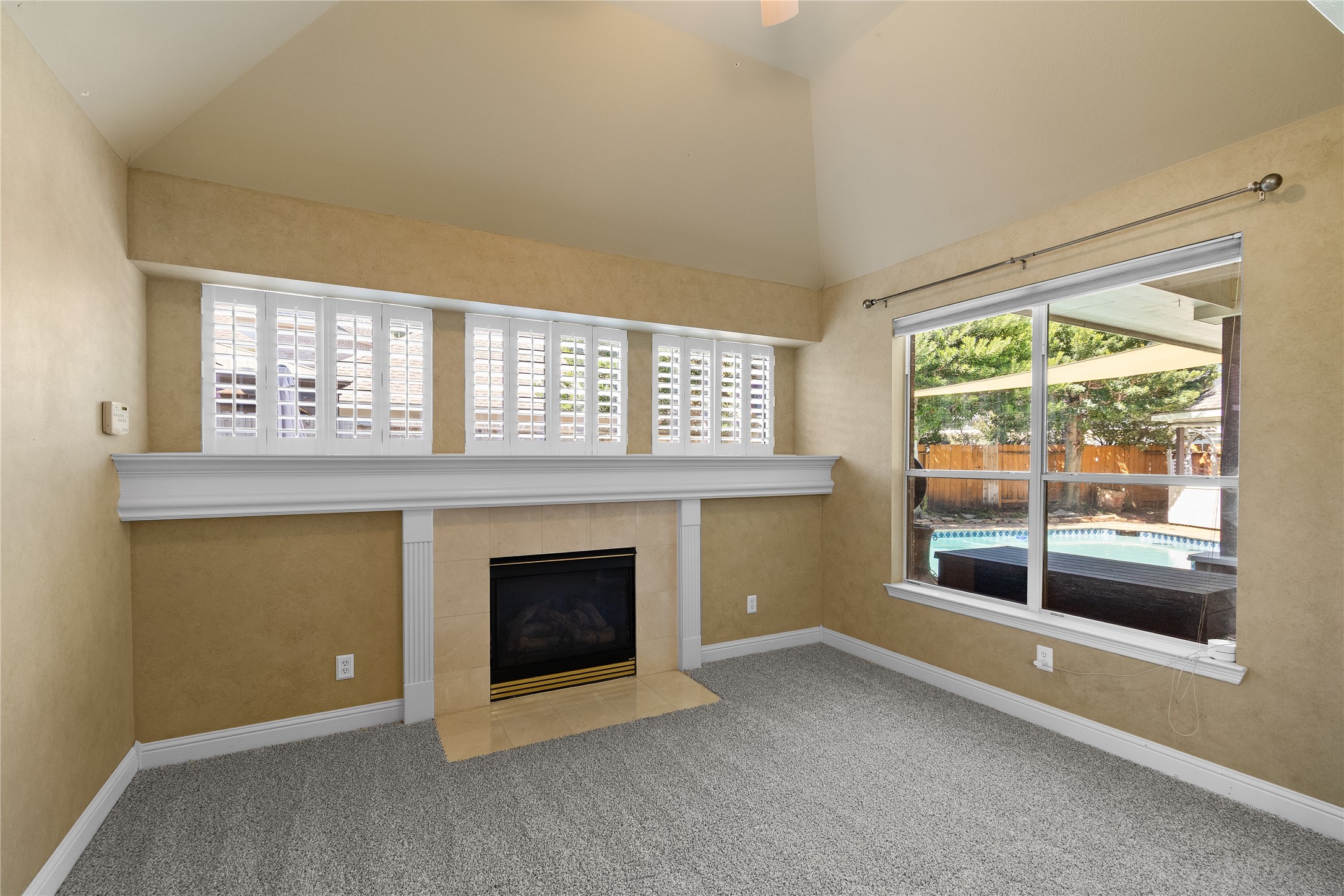 YOUR OWN PRIVATE SANCTUARY! The primary suite's approximately 13  10 sitting area features a fireplace and beautiful backyard views, creating a lovely retreat for reading, relaxing or enjoying a quiet evening.