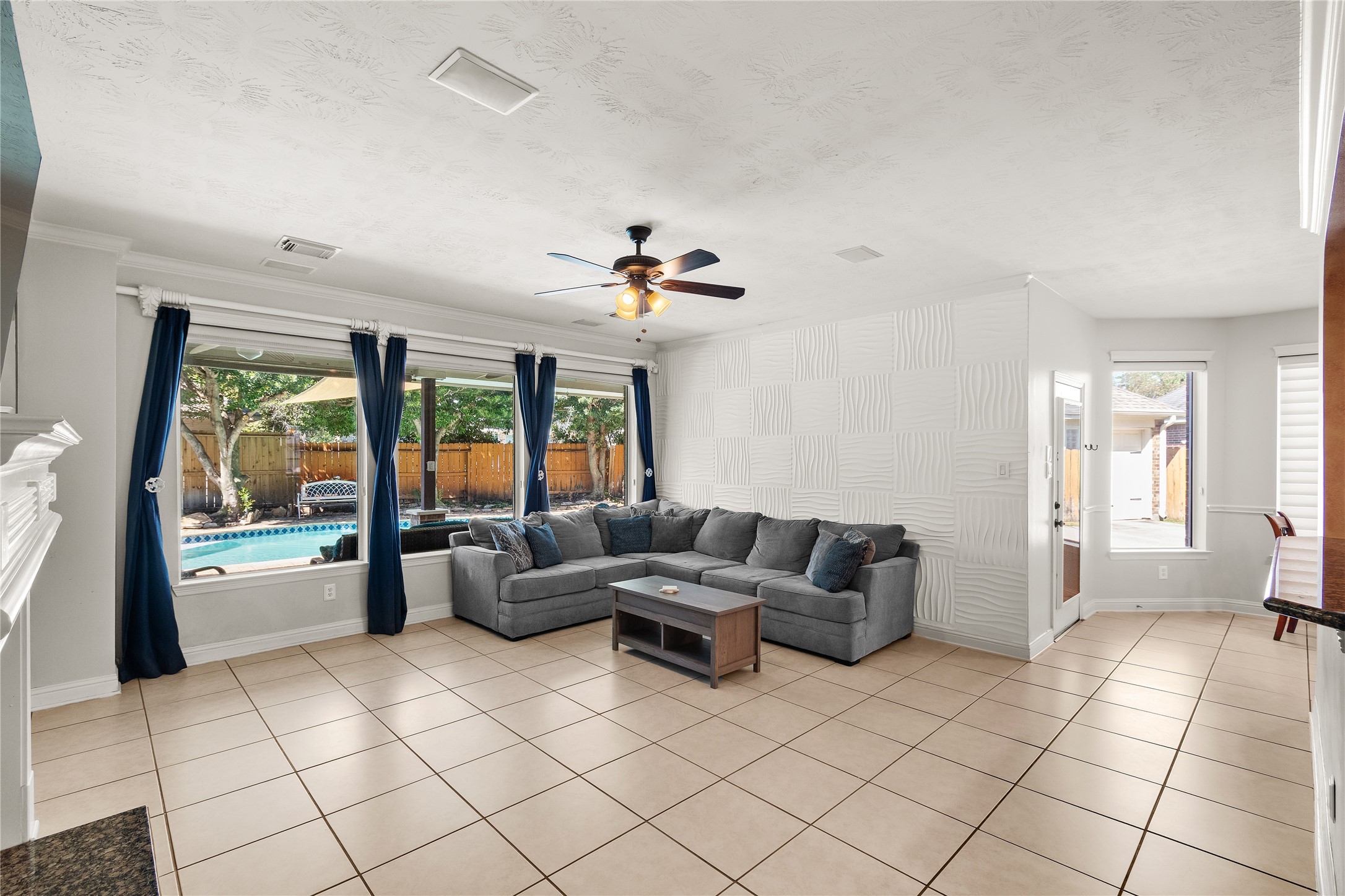 A wonderful gathering space with abundant natural light, generous seating possibilities and easy access to the home's kitchen and dining areas. Perfect for everything from quiet evenings to entertaining guests.