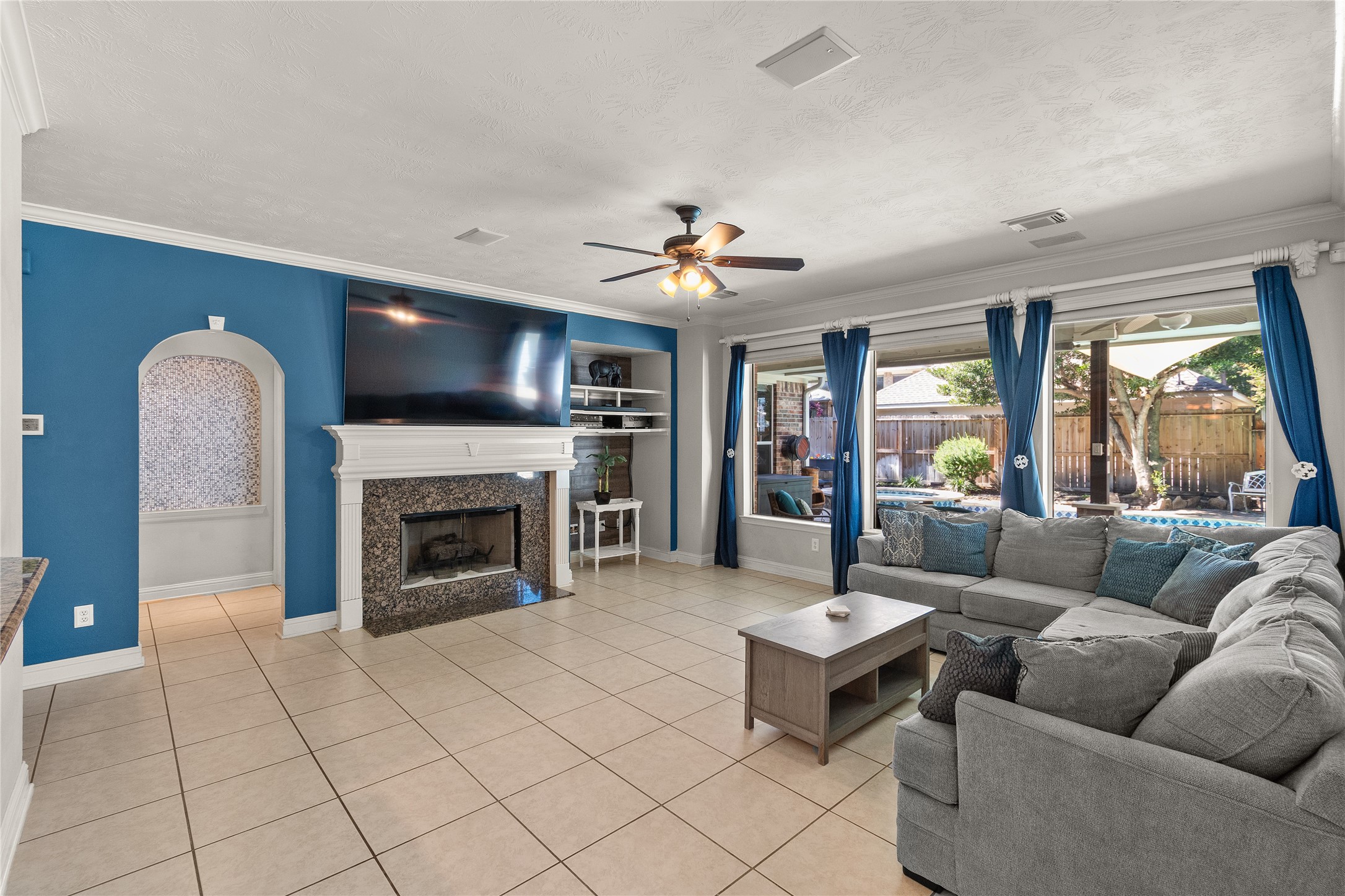 Designed for comfortable living and entertaining, this spacious family room features a fireplace, attractive architectural details and an open connection to the kitchen and breakfast areas.