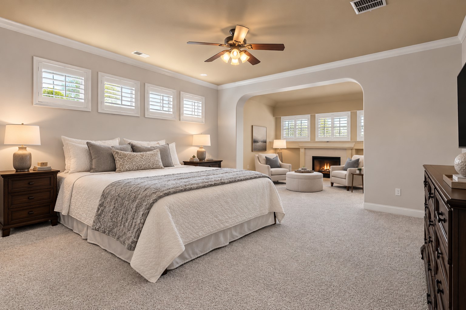 A BEAUTIFUL FIRST-FLOOR RETREAT! This generously sized primary bedroom features a raised ceiling, soft neutral finishes and a spacious layout designed for comfort and relaxation. **Digitally Staged**