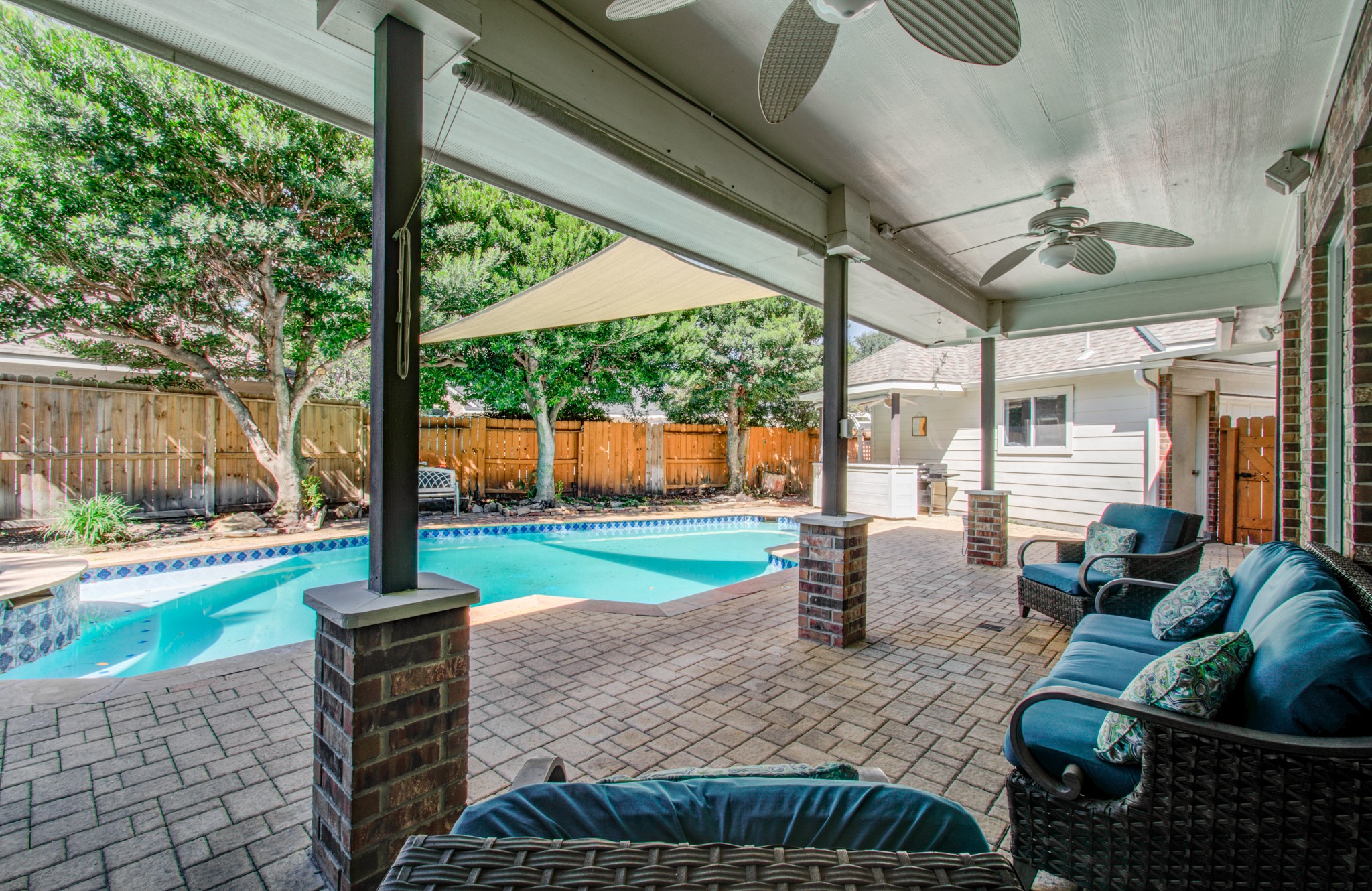 OUTDOOR LIVING AT ITS BEST! The spacious covered patio overlooks the private pool and spa, offering a wonderful shaded setting for entertaining friends, enjoying outdoor meals or simply unwinding.