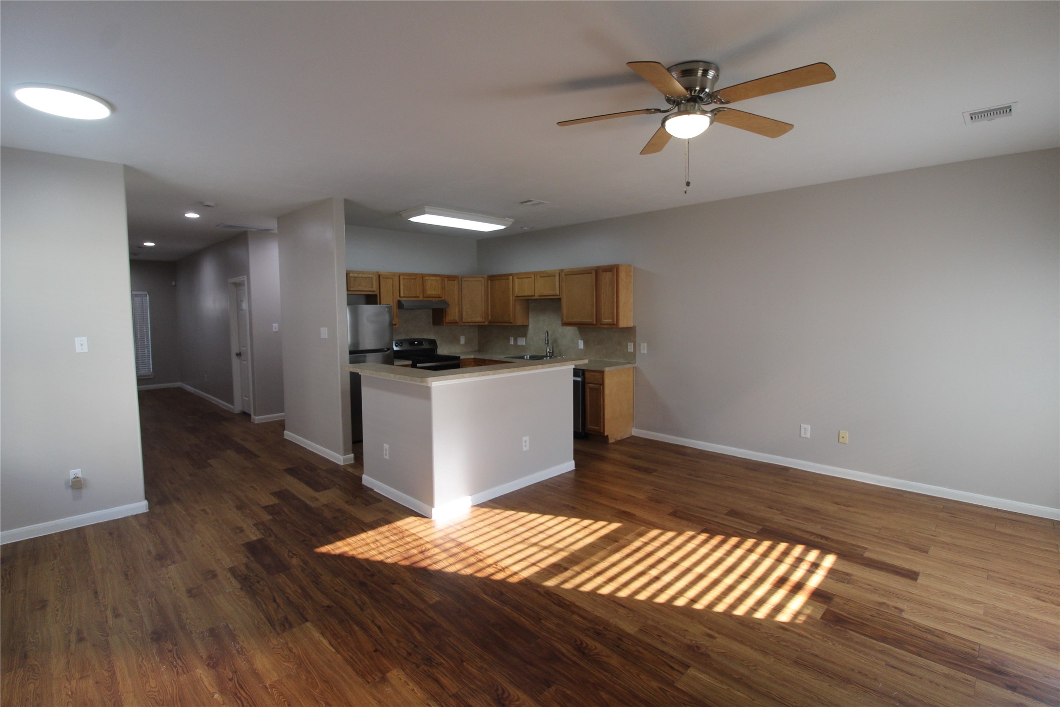 View of the open kitchen, family, and dining areas. View of the open kitchen, family, and dining areas.