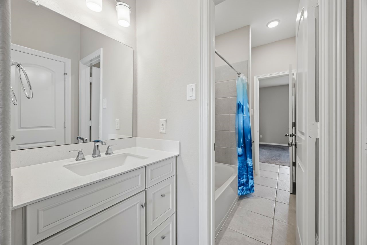 A detailed view of the dedicated vanity within the shared ensuite, offering a seamless and sophisticated transition between the two sleeping quarters.