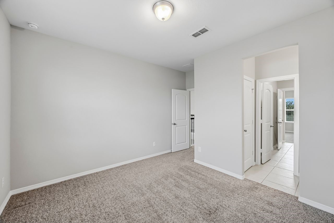 Two secondary bedrooms connected by a refined ensuite, featuring individual vanities and a seamless layout.