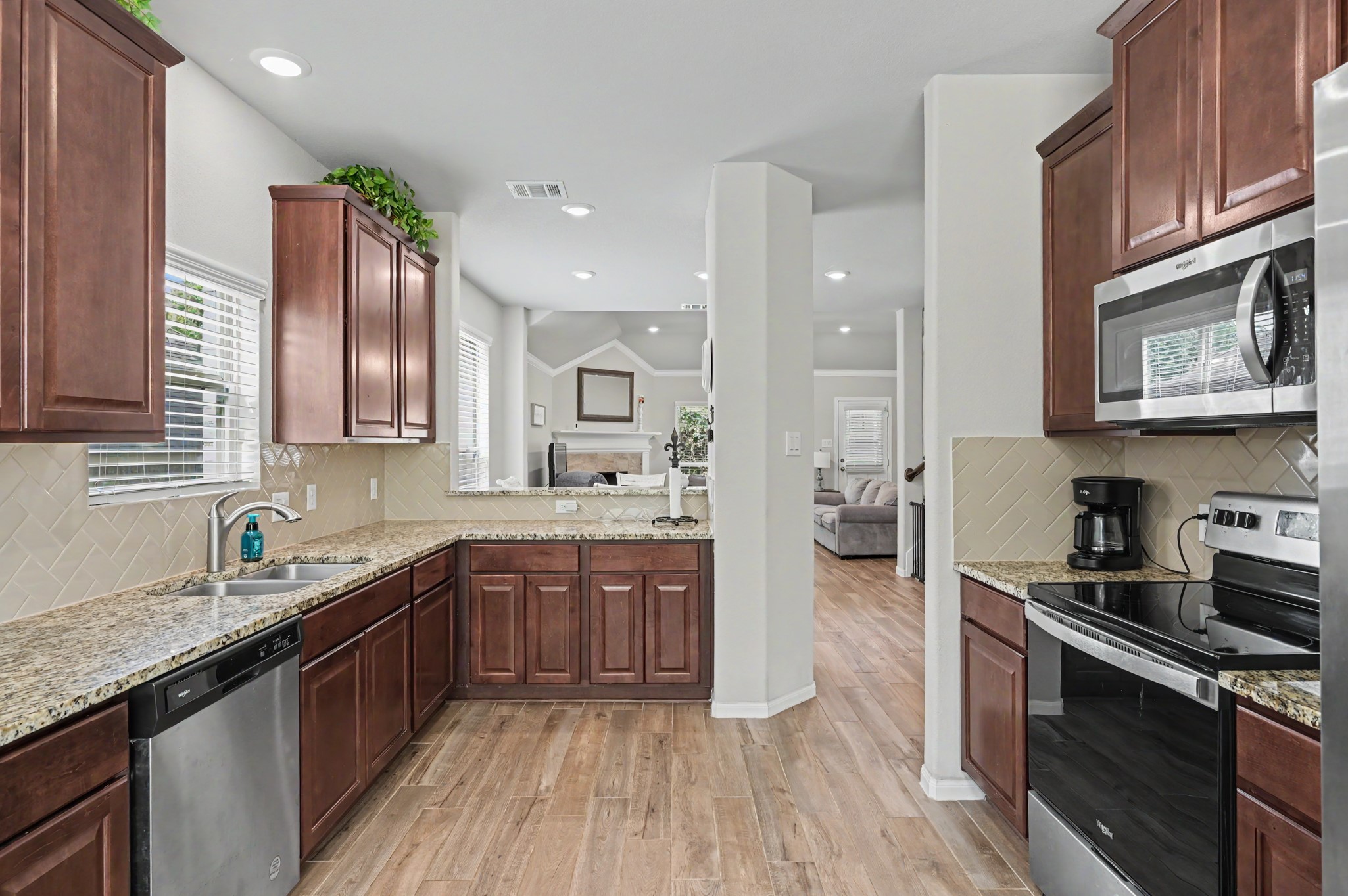 Granite Countertops, Stainless Steel Appliances, opens to Dining area and Bar counter