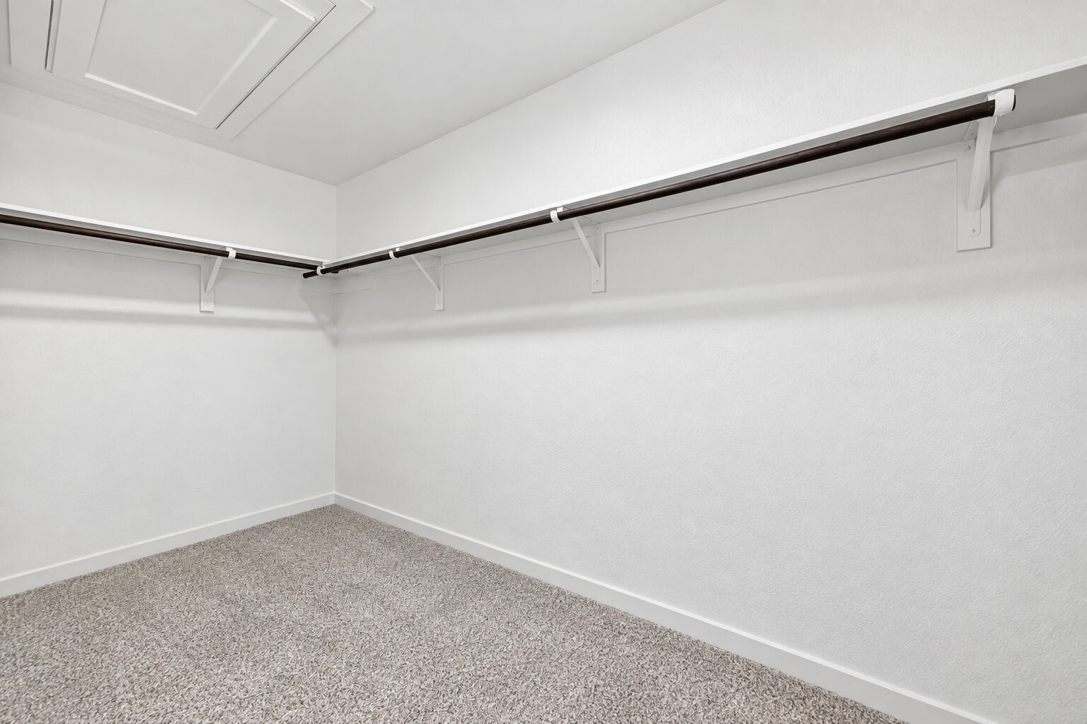 Make room for your wardrobe and everyday essentials in the primary closet.