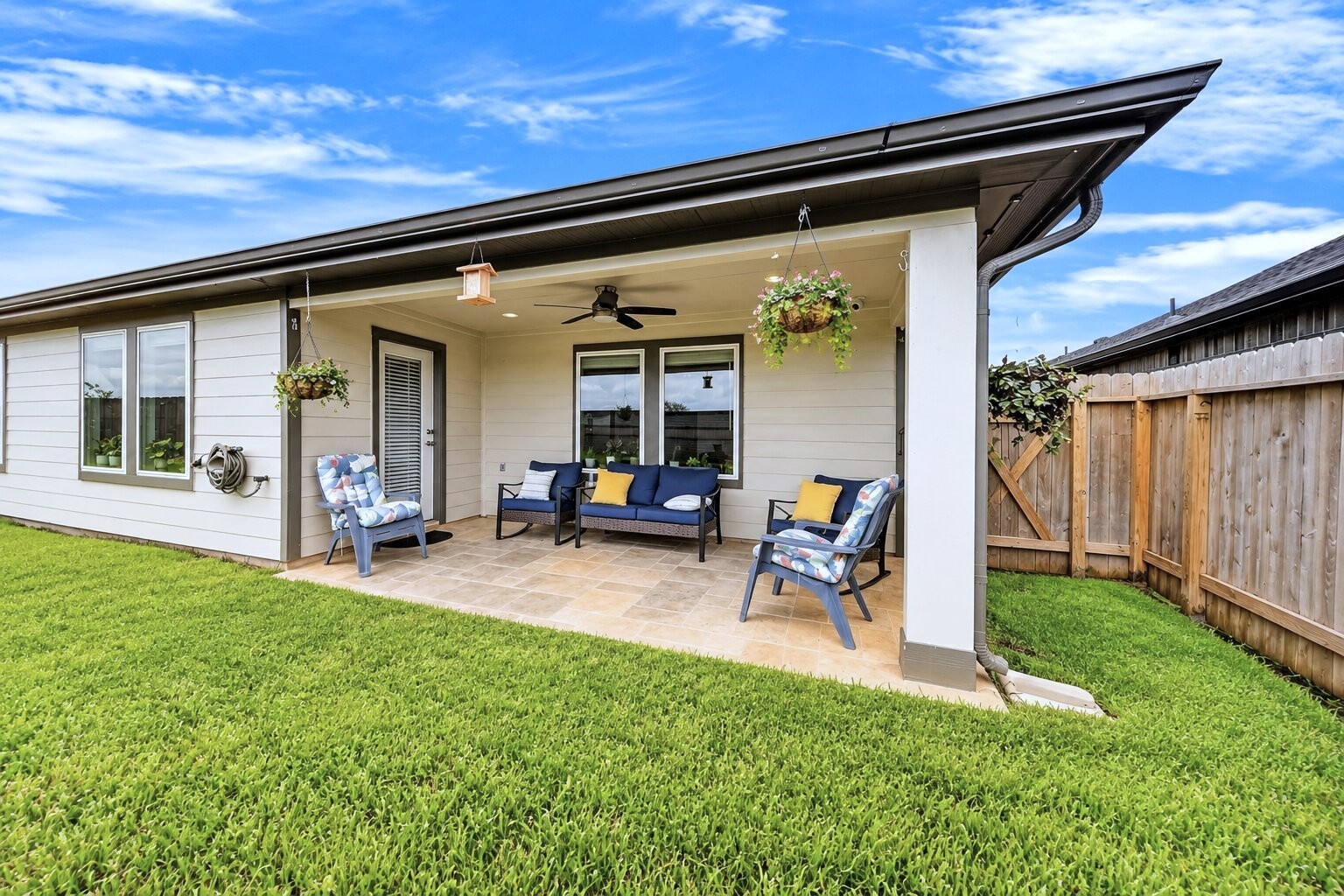 A backyard patio creates a spot to enjoy your morning coffee or unwind outdoors.