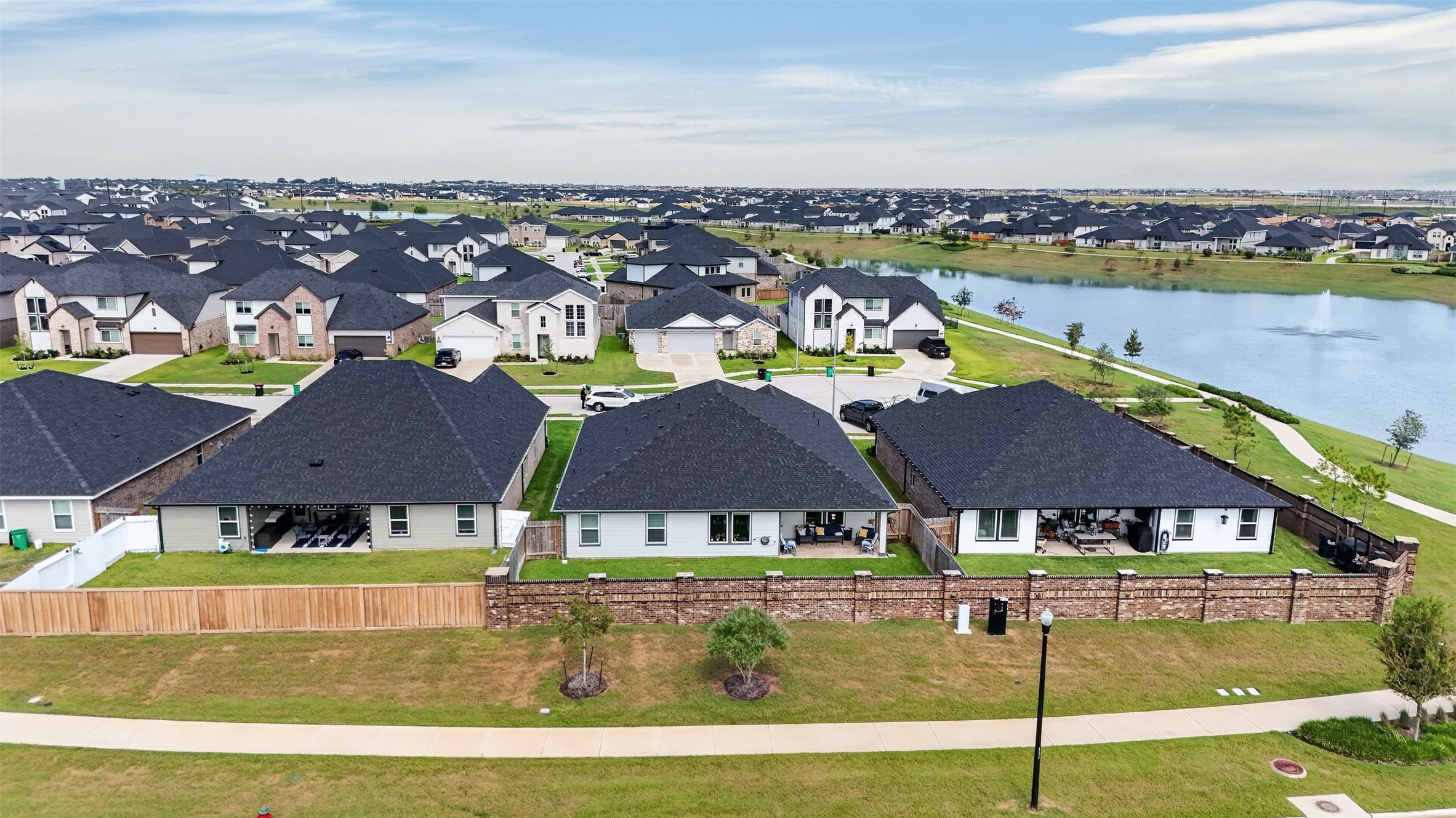 Enjoy a scenic view of the community and nearby walking trail, adding a pleasant outdoor setting to the surrounding neighborhood.