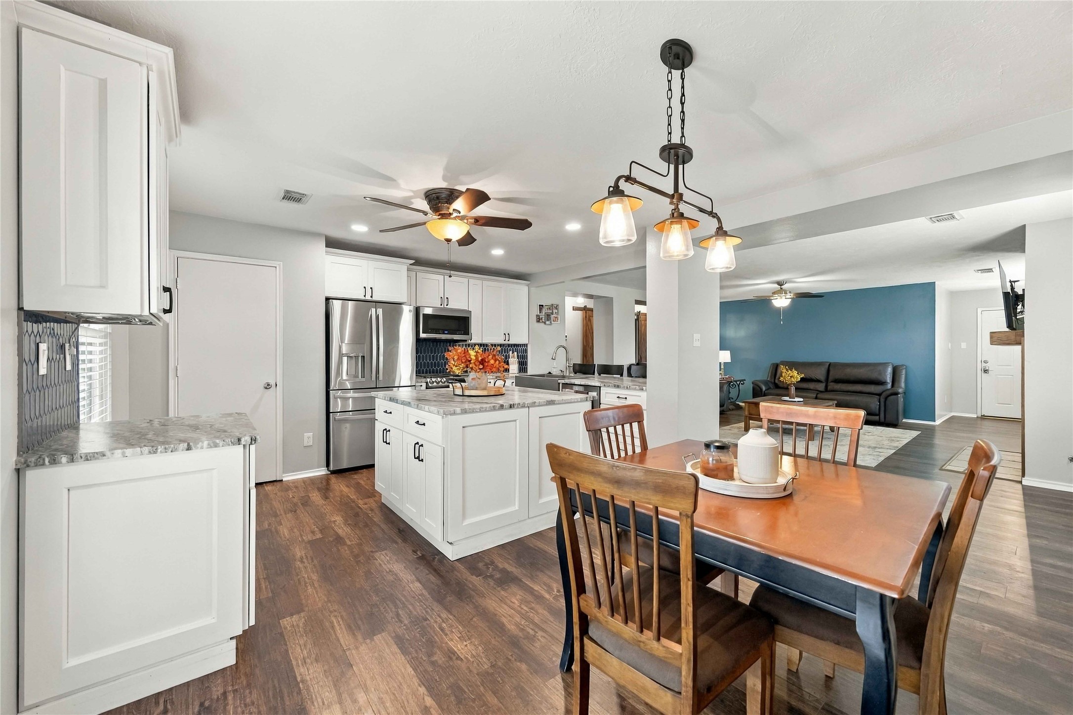 Open kitchen and dining layout connects seamlessly with the main living area, creating an expansive and functional floor plan.