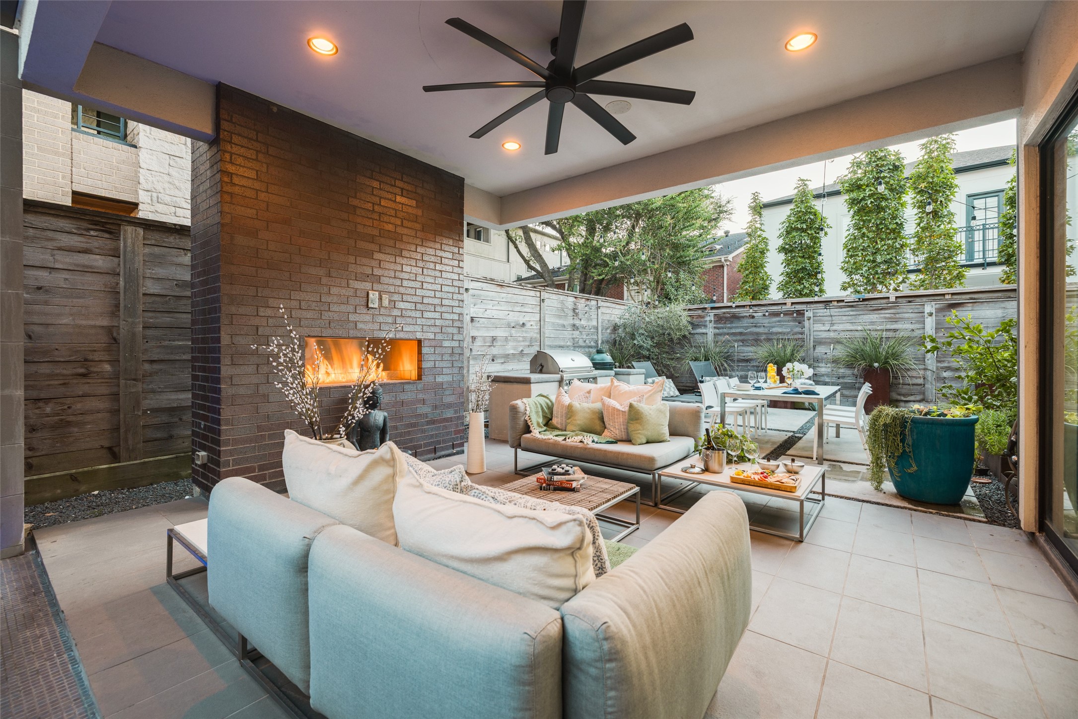 Experience the ultimate outdoor entertainment with floor-to-ceiling sliding glass doors that effortlessly open to the covered outdoor patio and backyard which is encased by an 8 foot cedar fence providing privacy