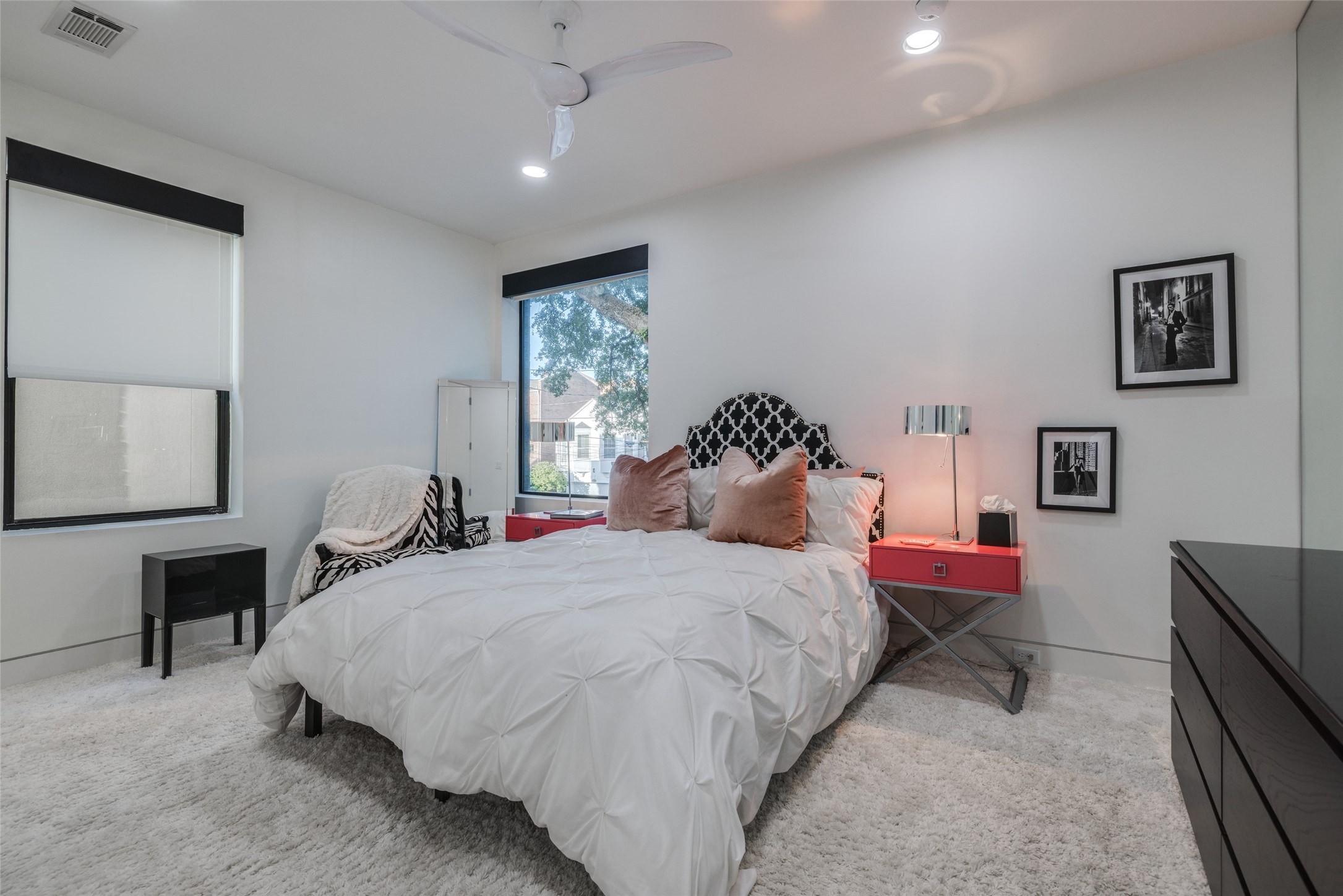 Bedroom 3 to the front of the home - designer carpet, custom designer window coverings, large walk in closet, recessed LED lighting, fan