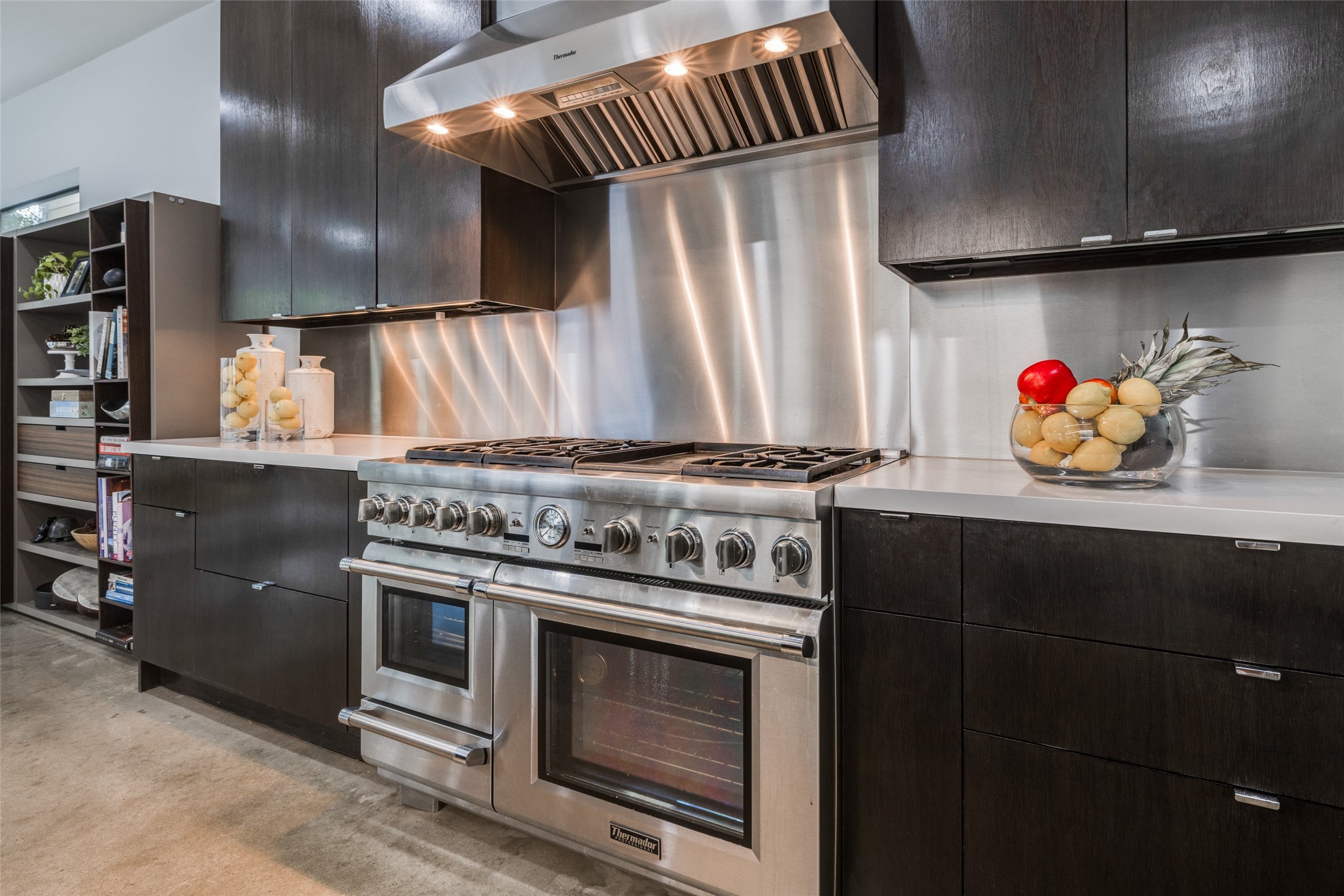 Gourmet Chef's Dream Kitchen with Thermador Professional Package - Range with gas 6 Burners, griddle, double oven, warming drawer, hood, SS refrigerator, SS backsplash, huge island with white quartz counter tops & waterfall edge
