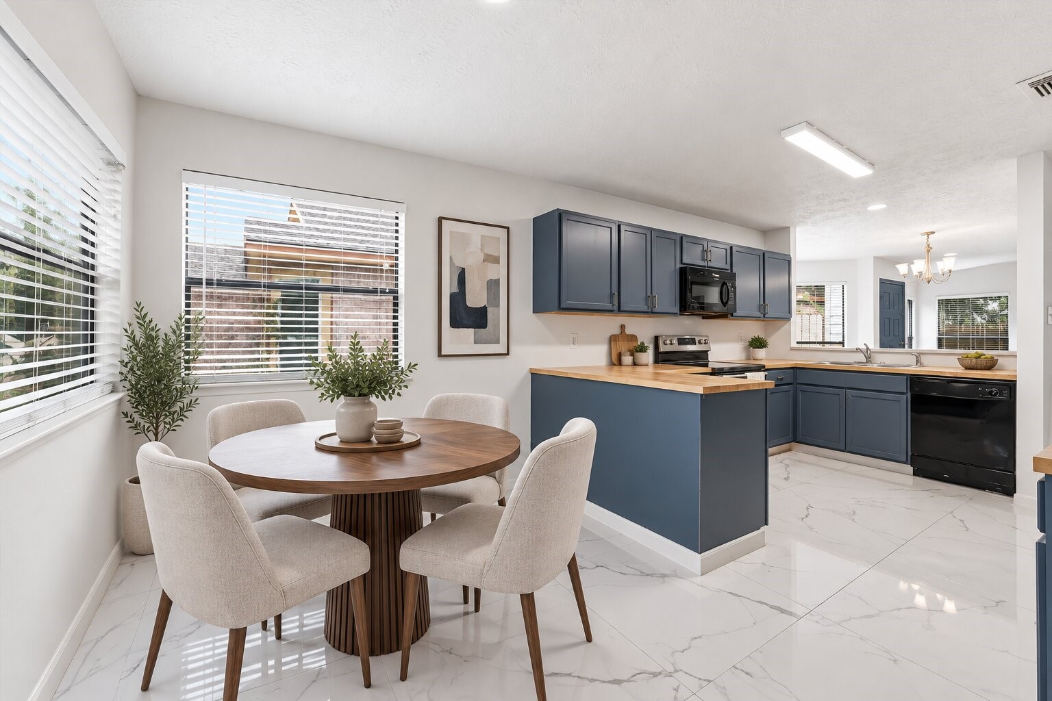 Virtual Staging Breakfast Nook. Breakfast area sits beside the kitchen, where two windows bring in natural light for everyday meals.