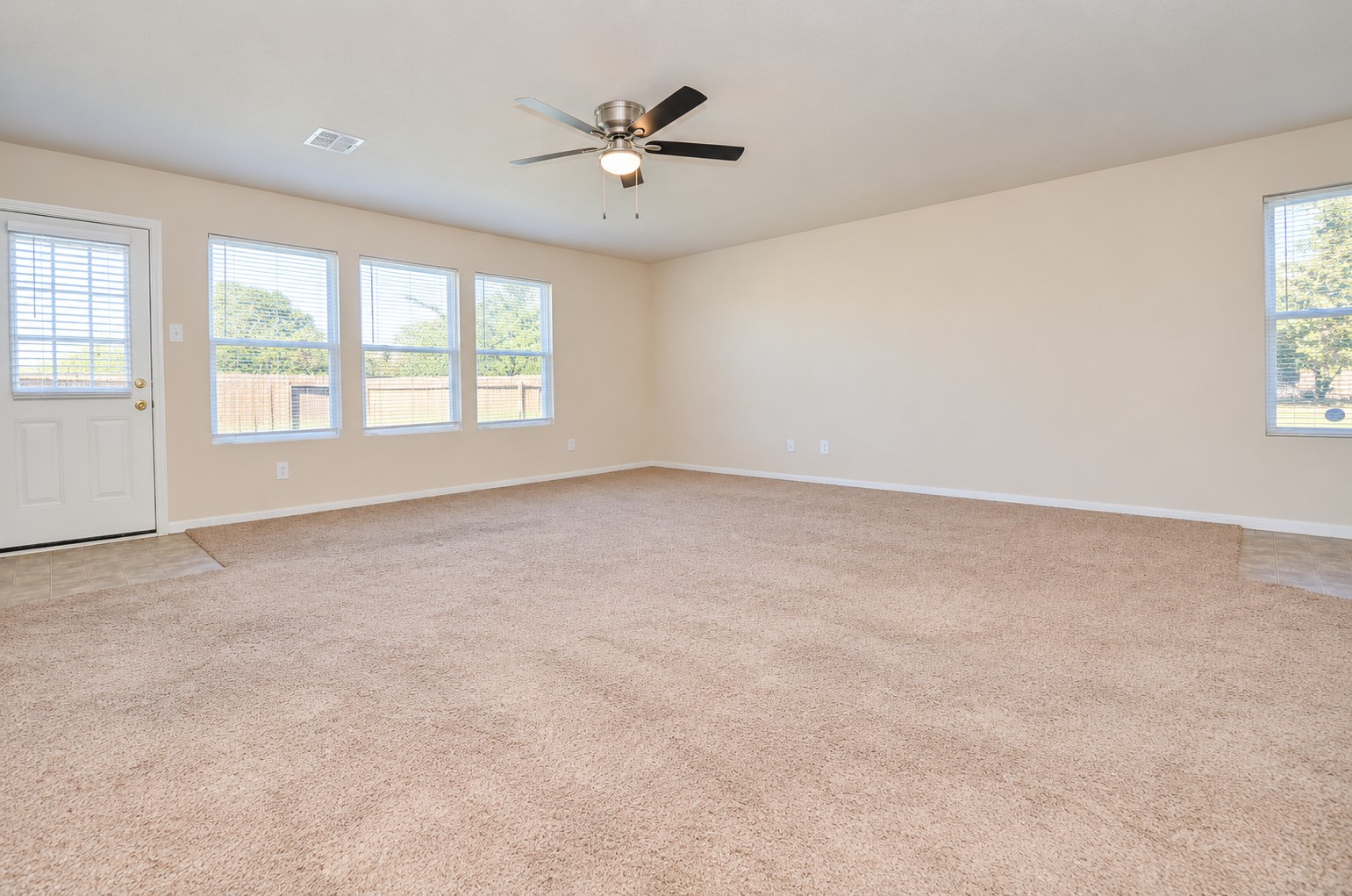 Additional family room view highlighting the open layout, generous floor space and natural light.