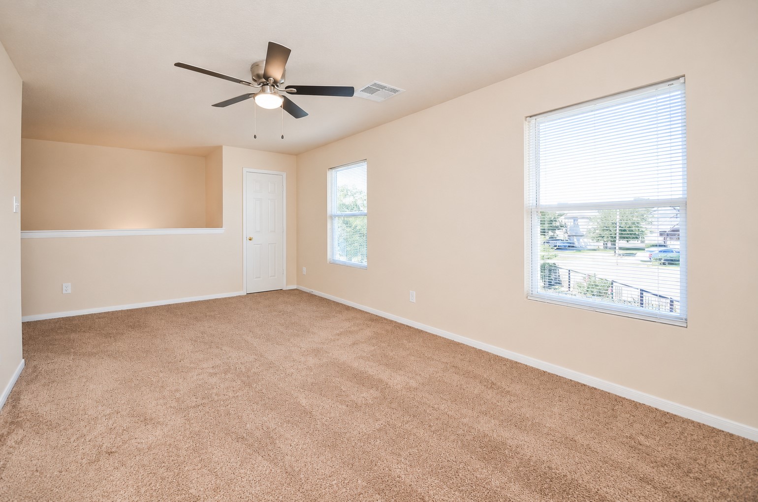 Additional view of the upstairs game room highlighting the generous floor space and versatile layout, ideal for a media room, playroom or second living area.
