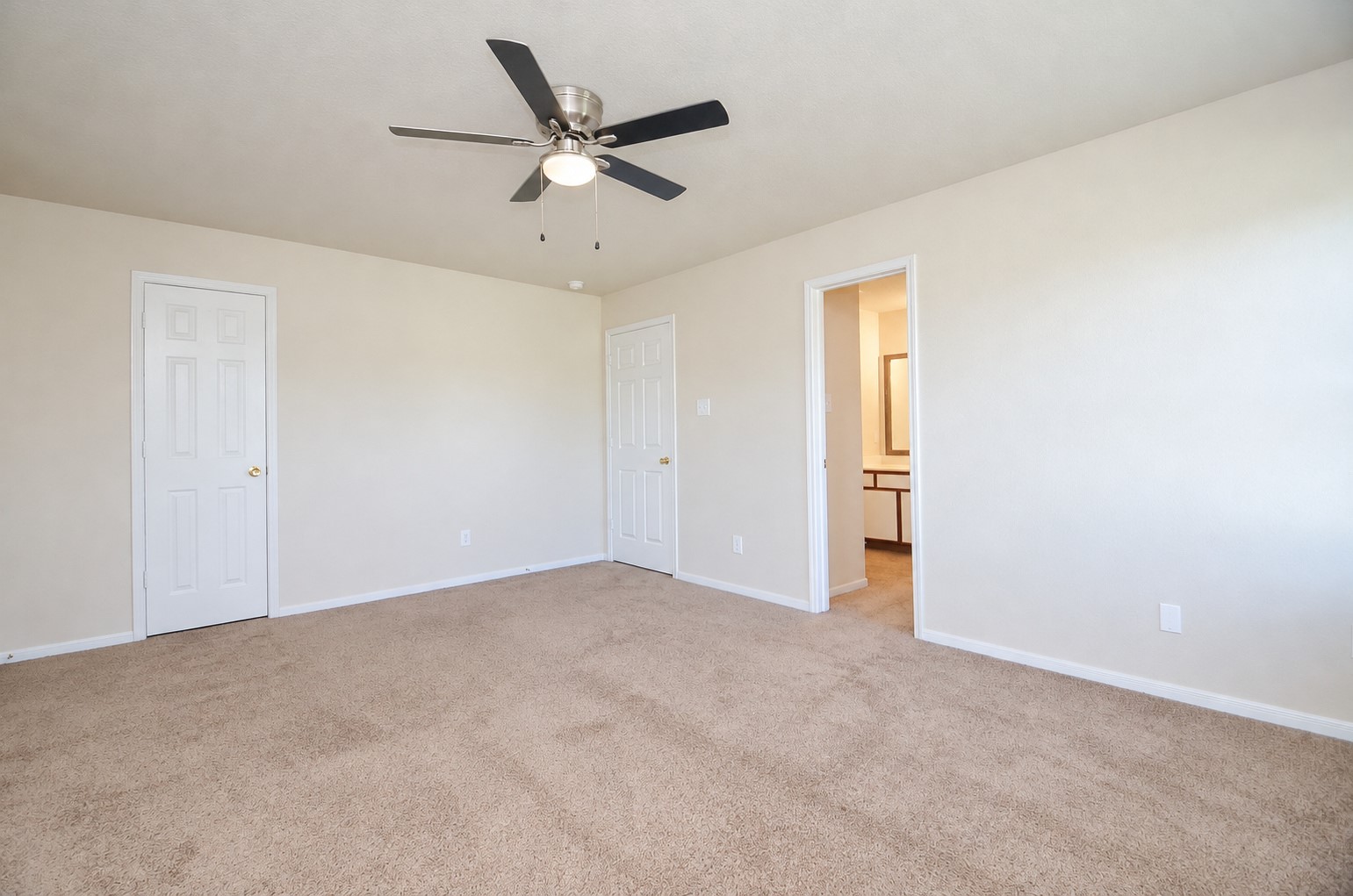 Spacious second-floor bedroom offering the flexibility to serve as a second primary bedroom, with ample room for a king-size bed and additional furnishings.