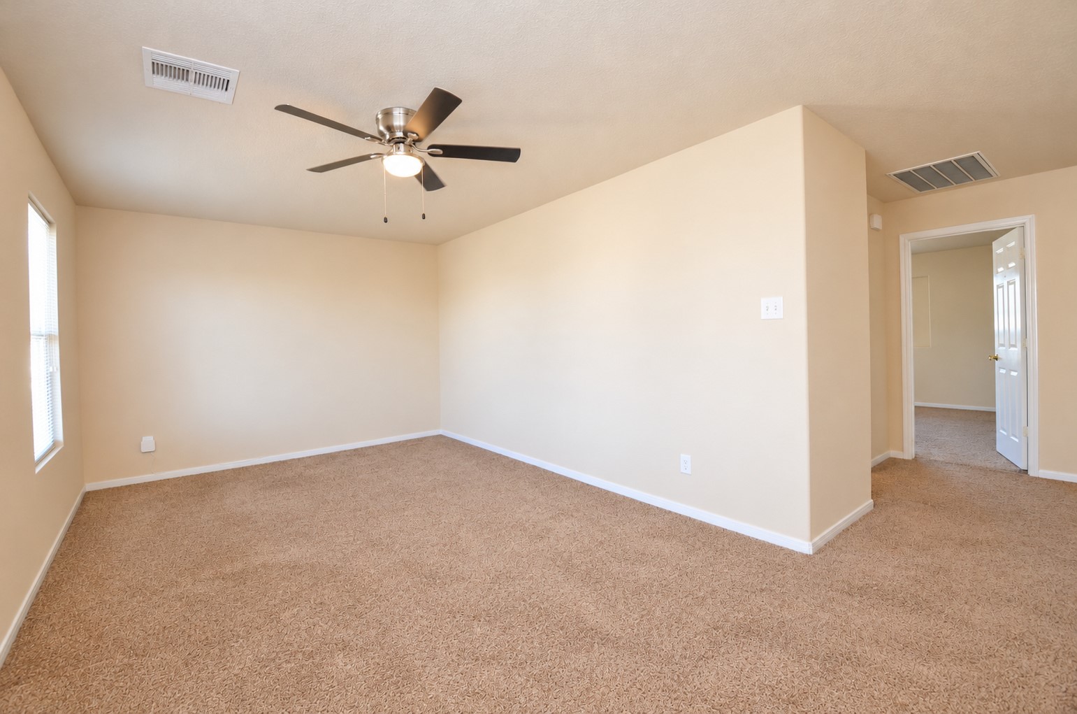 Additional view of the spacious upstairs game room, offering flexible space for a home theater, gaming area or second living room.