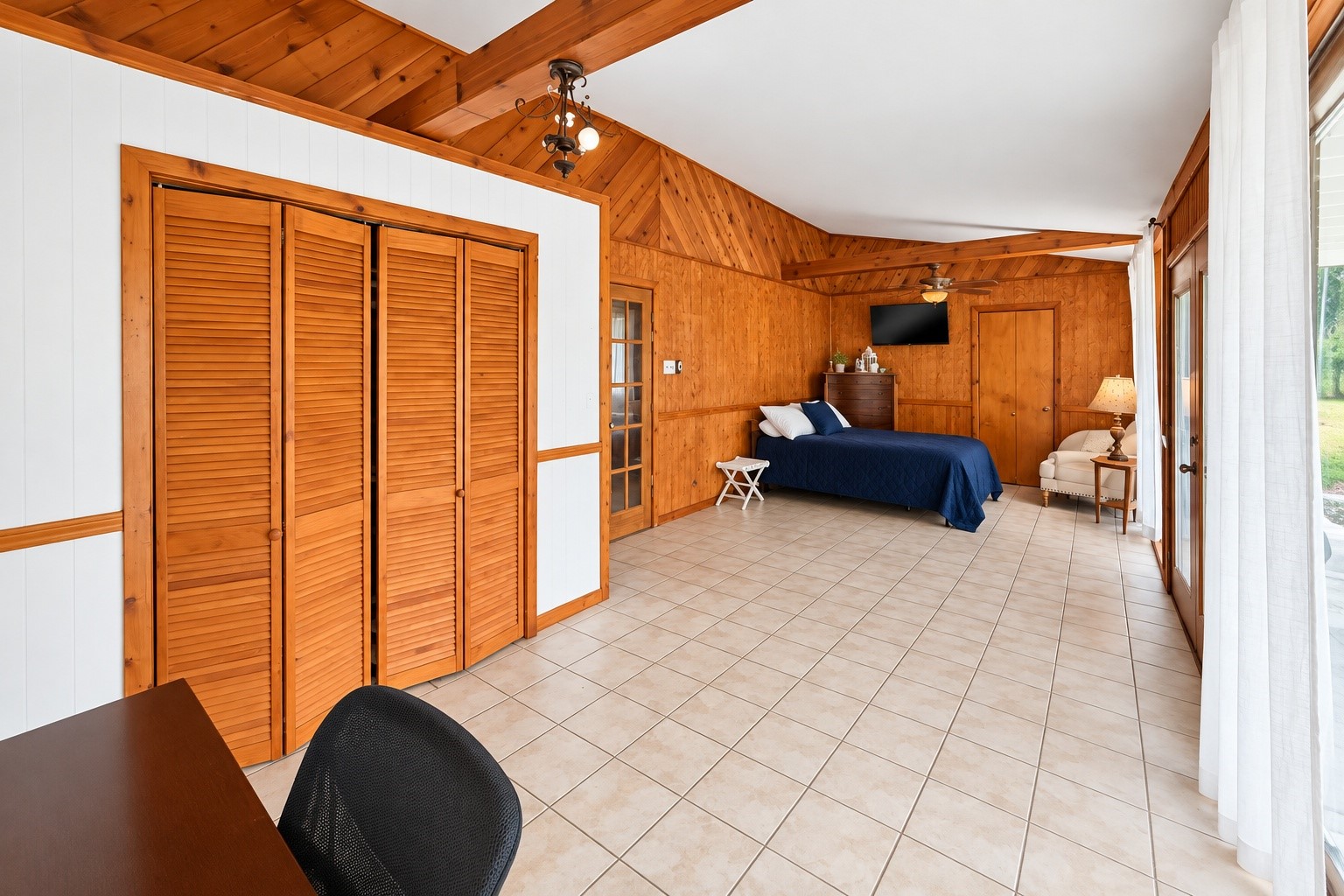 Laundry located through the far closet door on the other side of the bed.