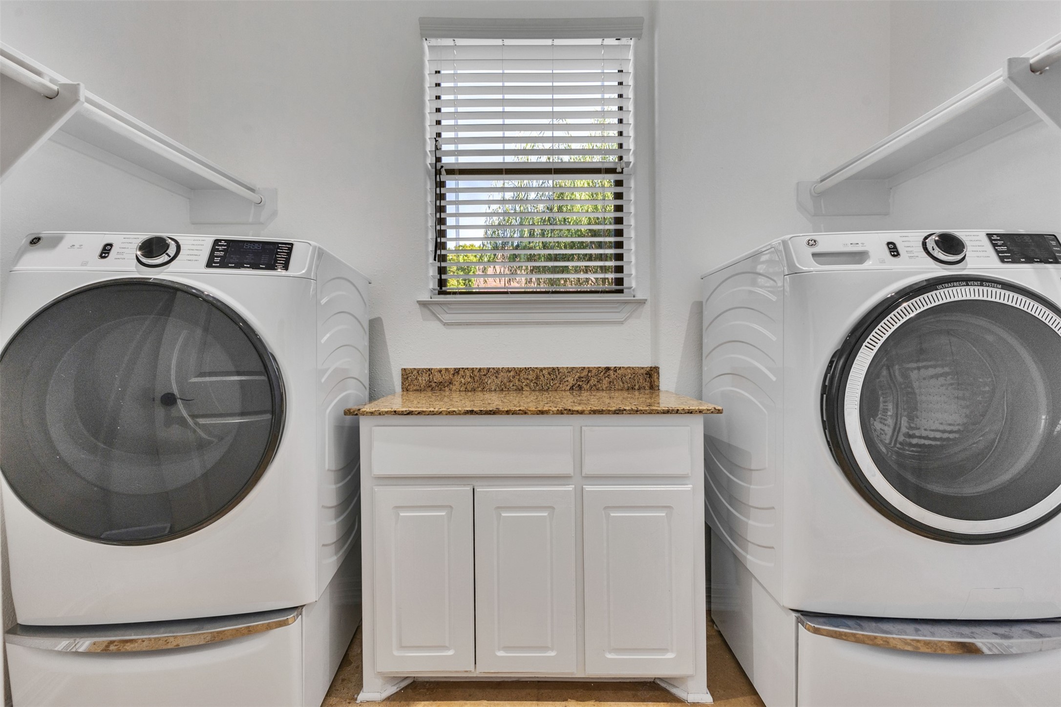 A dedicated laundry room provides a practical space to keep everyday chores organized and tucked away from the main living areas.